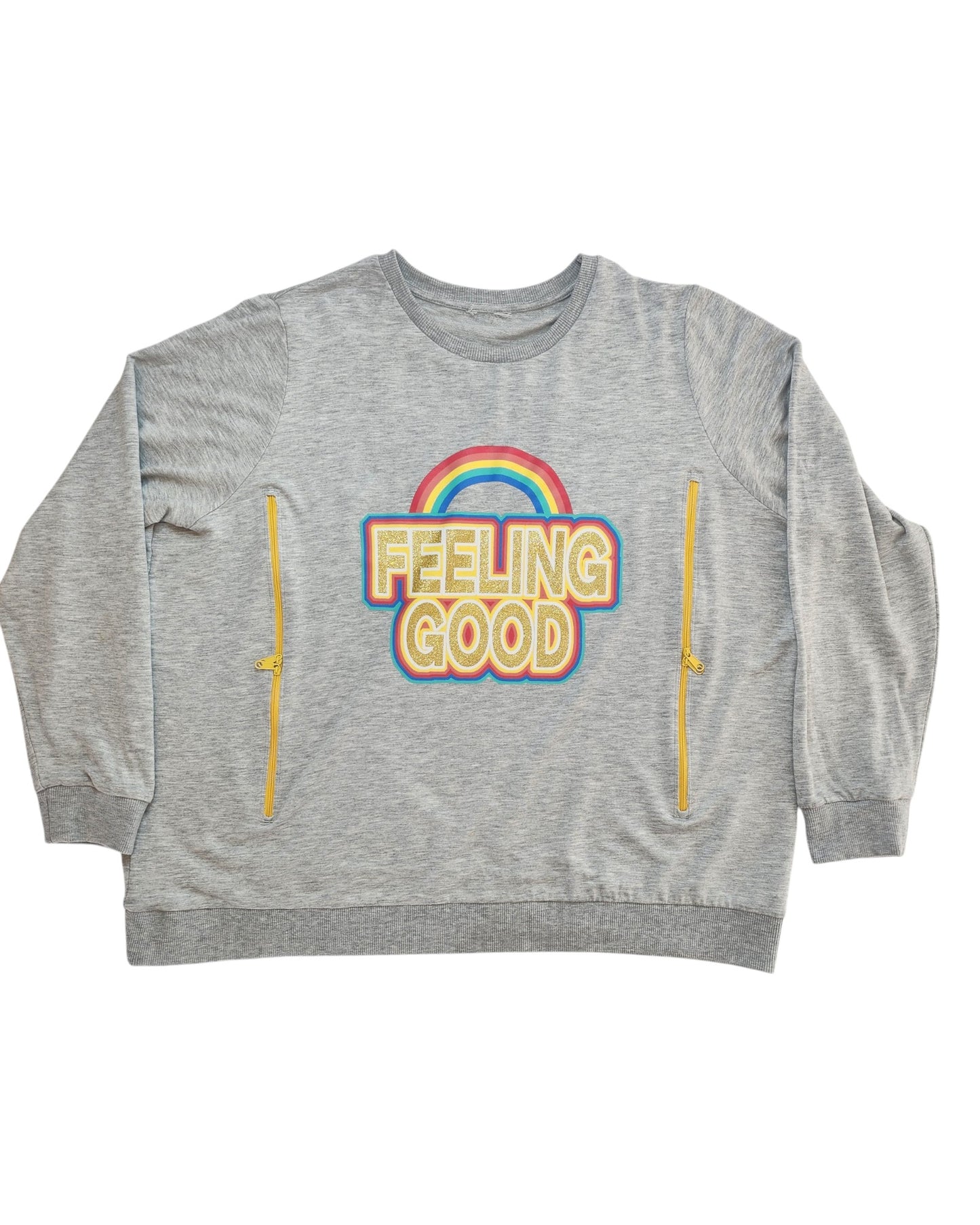 The Upcycled Breastfeeding & Pumping Feeling Good Sweatshirt by touched out mama features gray long sleeves with FEELING GOOD text and a rainbow design. Crafted from eco-friendly materials, it includes two yellow vertical zippers for style and practicality. UK size 22.