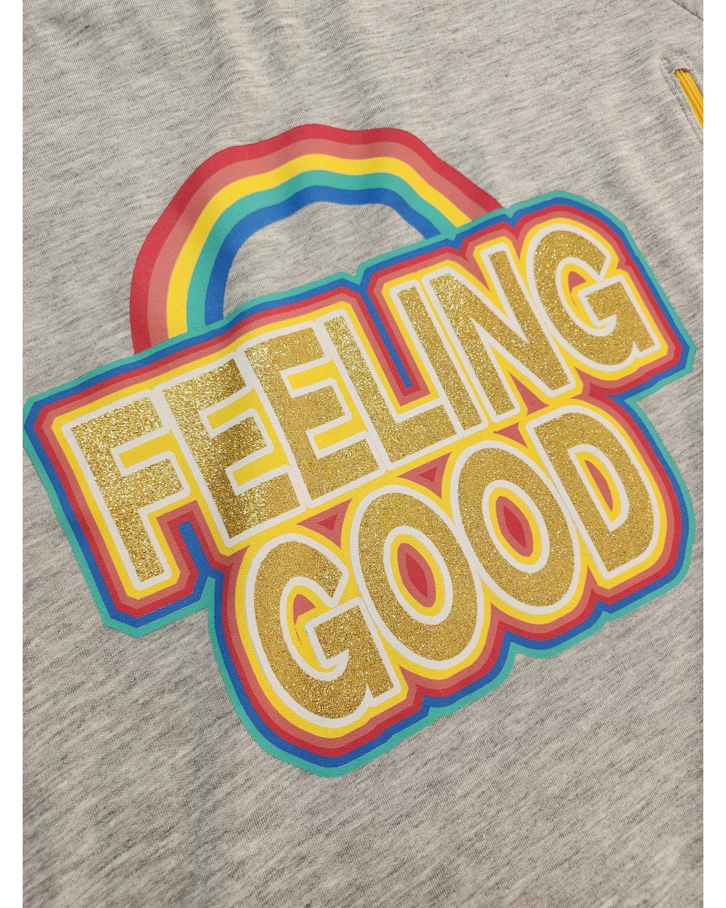 The touched out mama Upcycled Breastfeeding & Pumping Feeling Good Sweatshirt UK22 features eco-friendly gray fabric with FEELING GOOD in bold yellow, a glittery effect outlined in blue and red, and a multicolored rainbow arching above it.