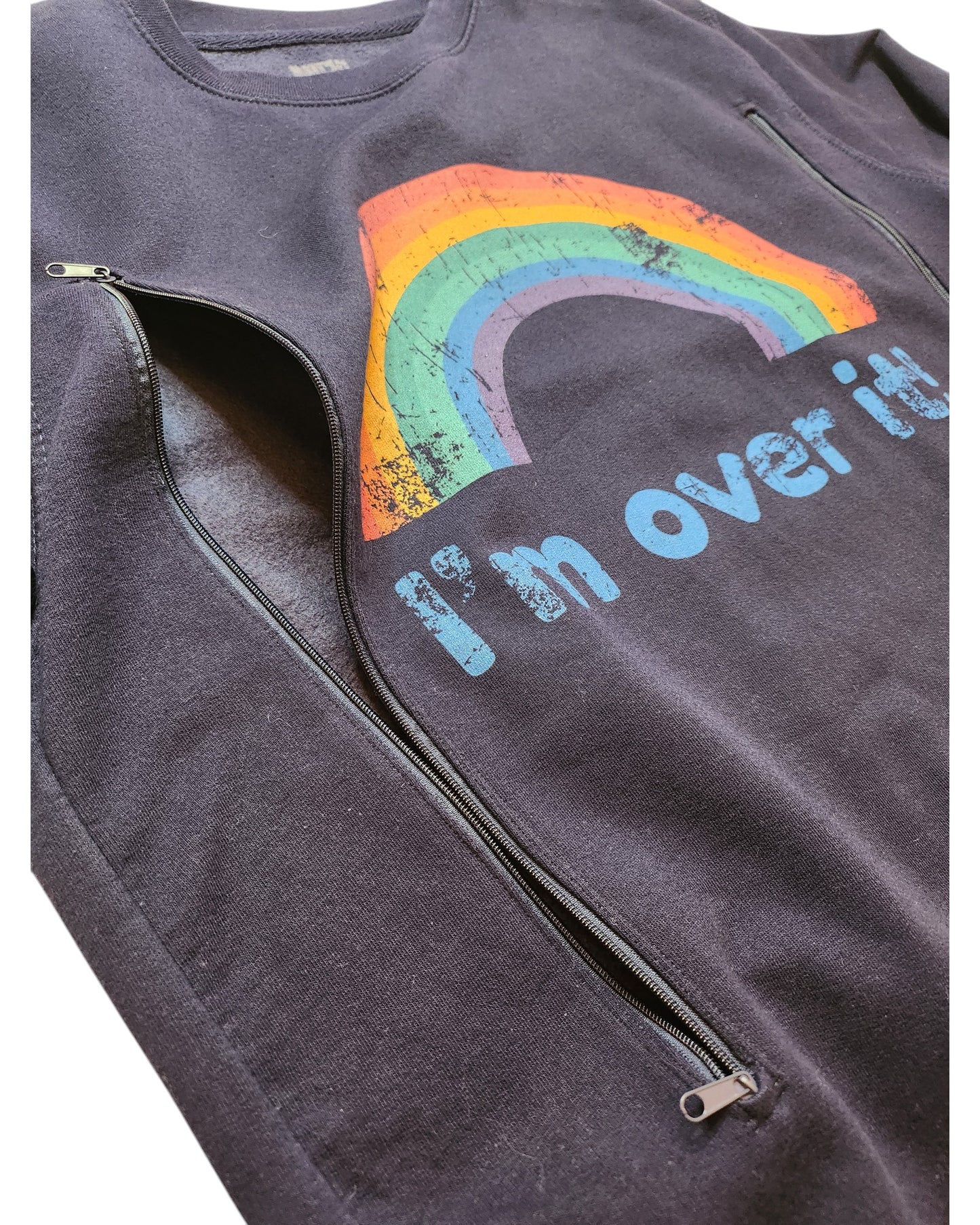 Close-up of the Upcycled Breastfeeding & Pumping Rainbow Sweatshirt L by touched out mama, a preloved black sweatshirt with a colorful distressed rainbow graphic and Im over it text. It features a side zipper for easy breastfeeding access.