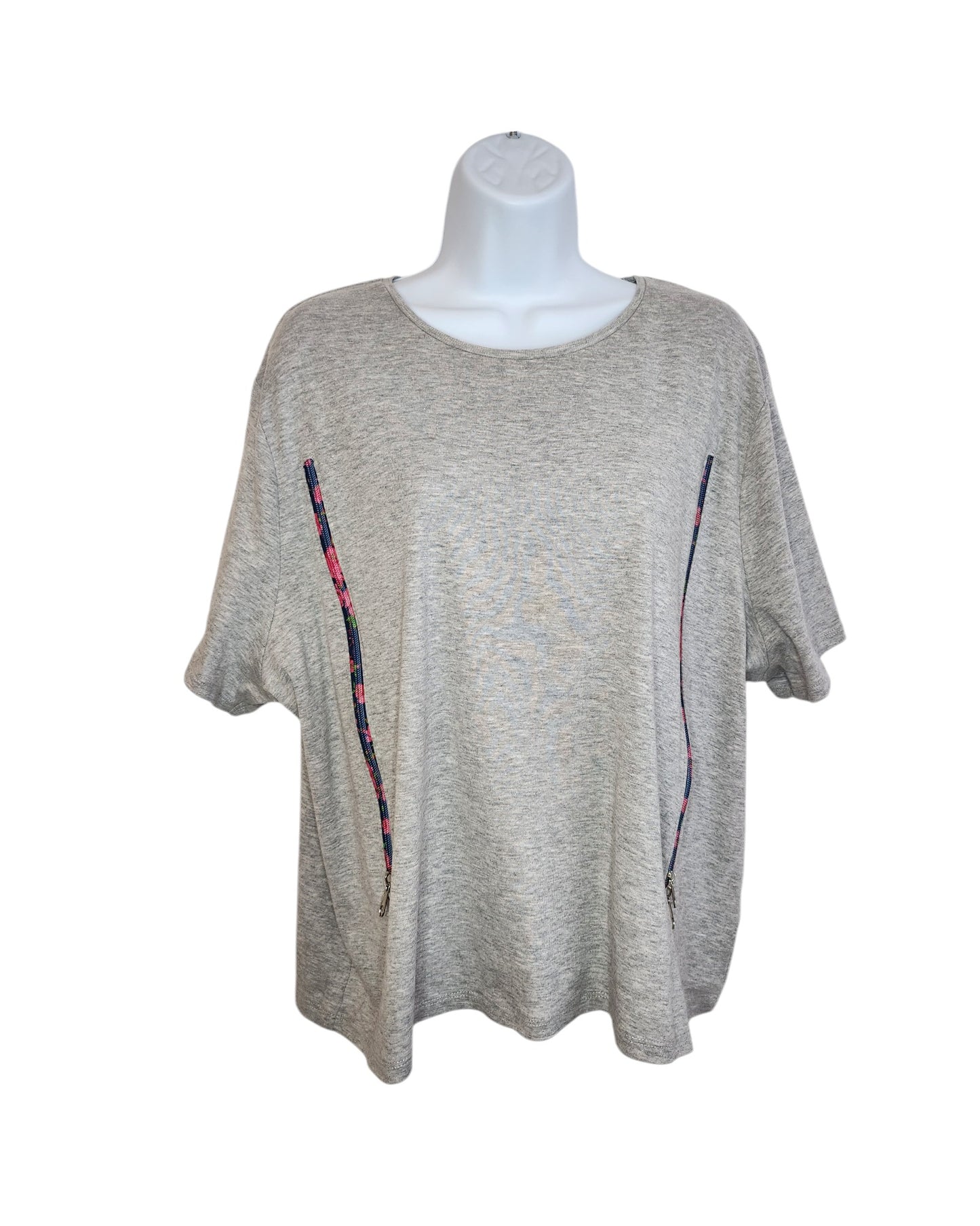 The product is an Upcycled Breastfeeding (Nursing) & Pumping Grey Floral Zips T-shirt UK24 by touched out mama, displayed on a white mannequin. It features subtly charming colorful vertical stripes and multicolored lines from the bottom to the chest, highlighting its unique upcycled design.