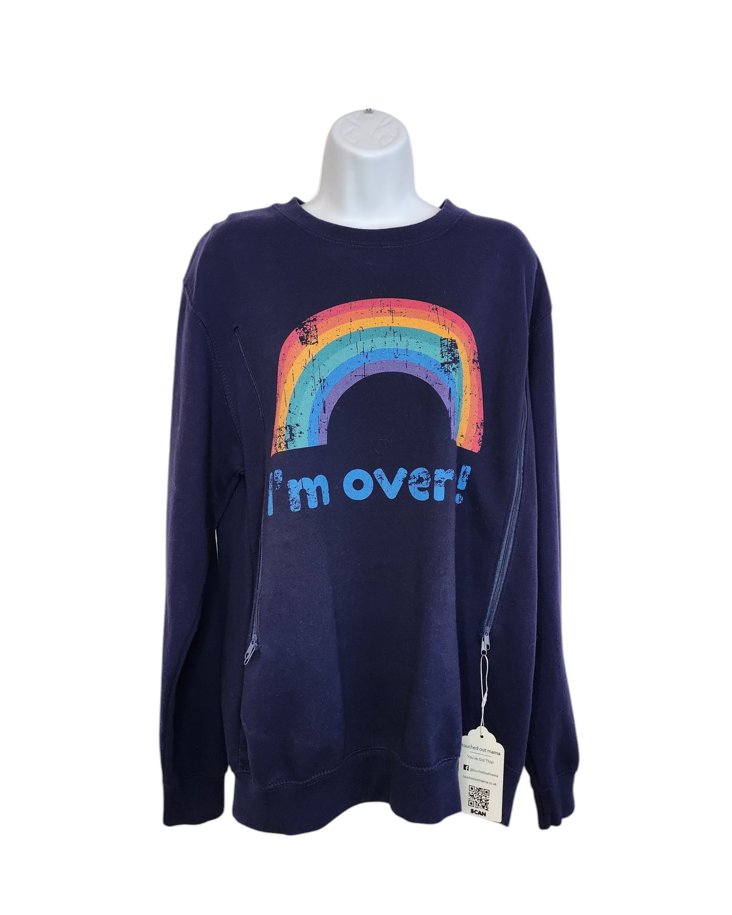 On a mannequin, the touched out mama navy sweatshirt showcases a vintage rainbow graphic with Im over! in blue. Made from upcycled materials, it features a white tag with a QR code.