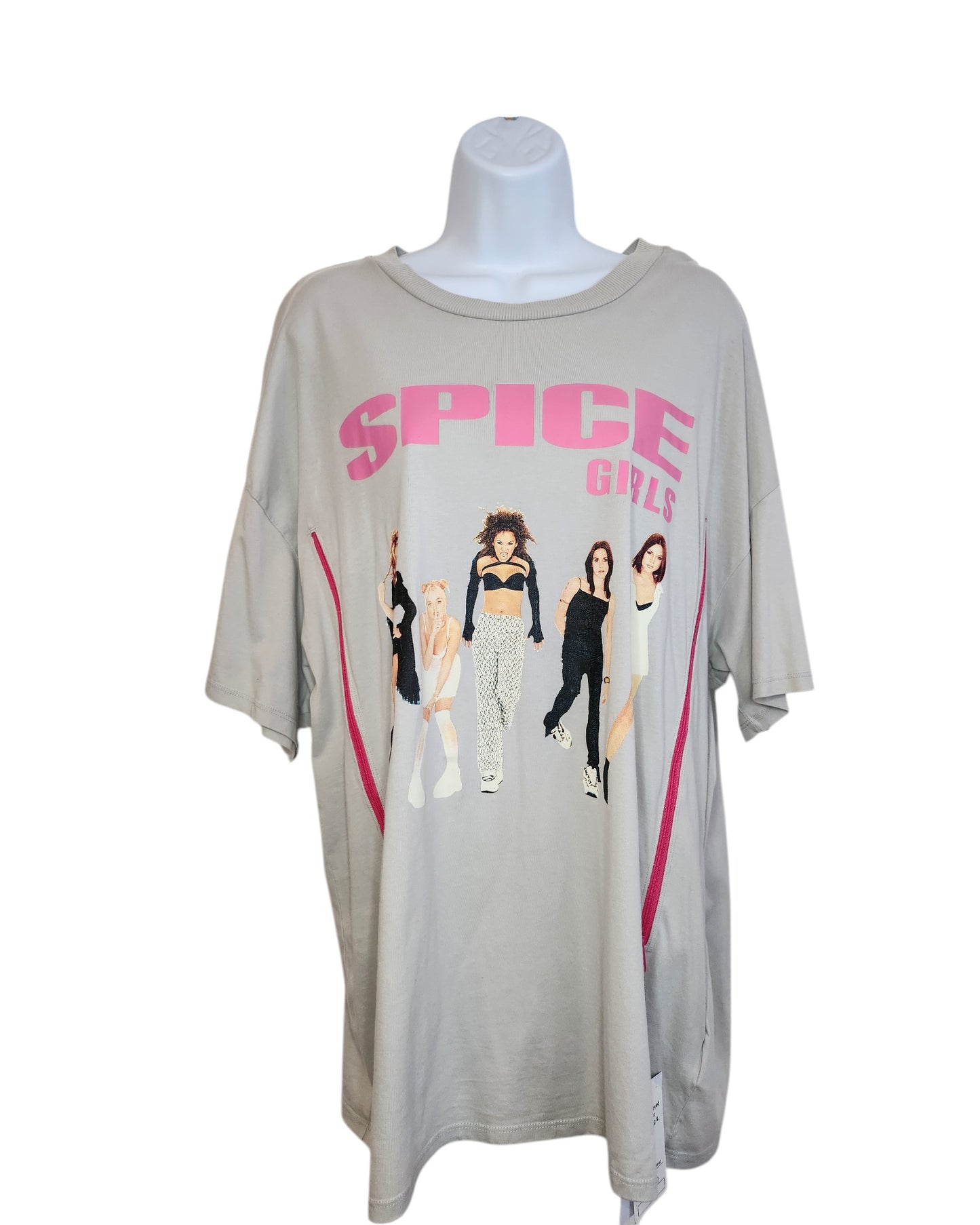 Displayed on a mannequin, this beige Upcycled Breastfeeding & Pumping Spice Girls T-shirt by touched out mama features SPICE GIRLS in pink letters above a graphic of five women, crafted from preloved clothing for an eco-friendly nod to iconic pop culture.