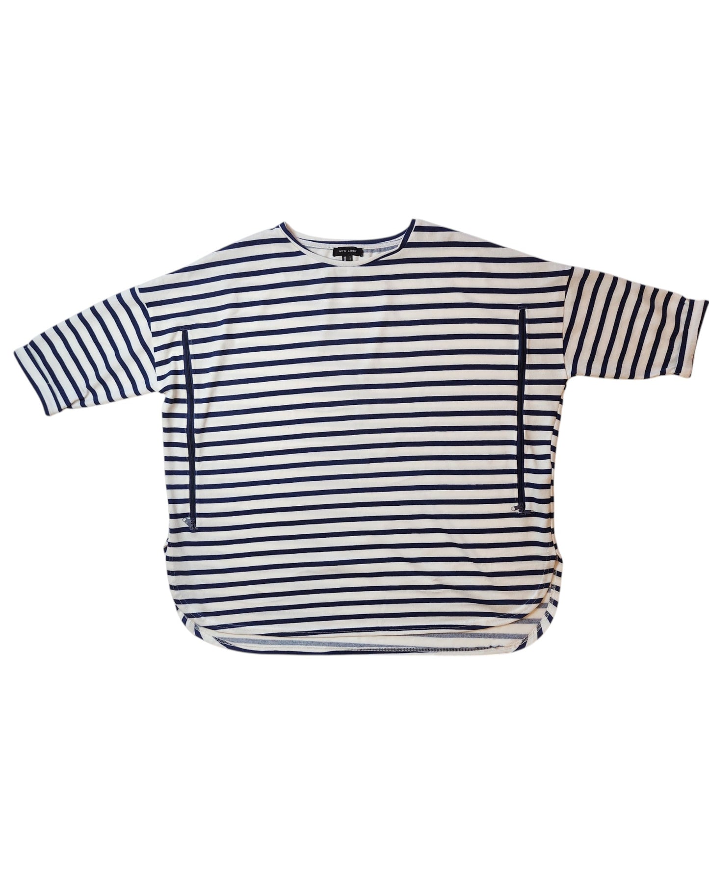 This preloved Upcycled Breastfeeding & Pumping Stripe Knit Top L by touched out mama is a loose-fitting white shirt with navy blue stripes, three-quarter sleeves, and a rounded hemline, perfect for effortless style.