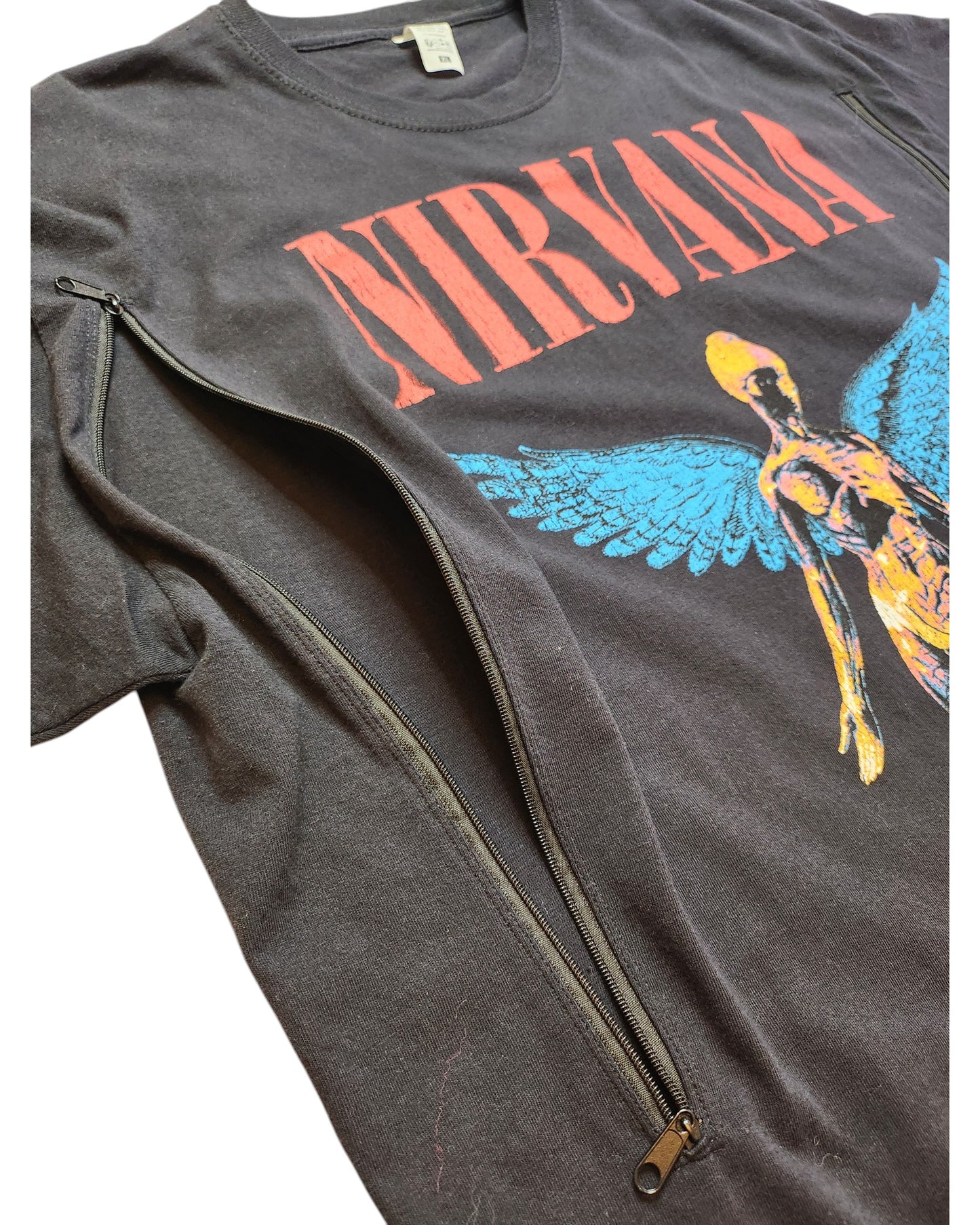 The touched out mama Upcycled Breastfeeding Nirvana T-shirt in XL features a striking angel with blue wings on dark gray fabric. With zippers along the arms and bold red letters spelling the bands name, it offers a preloved rock-chic style.