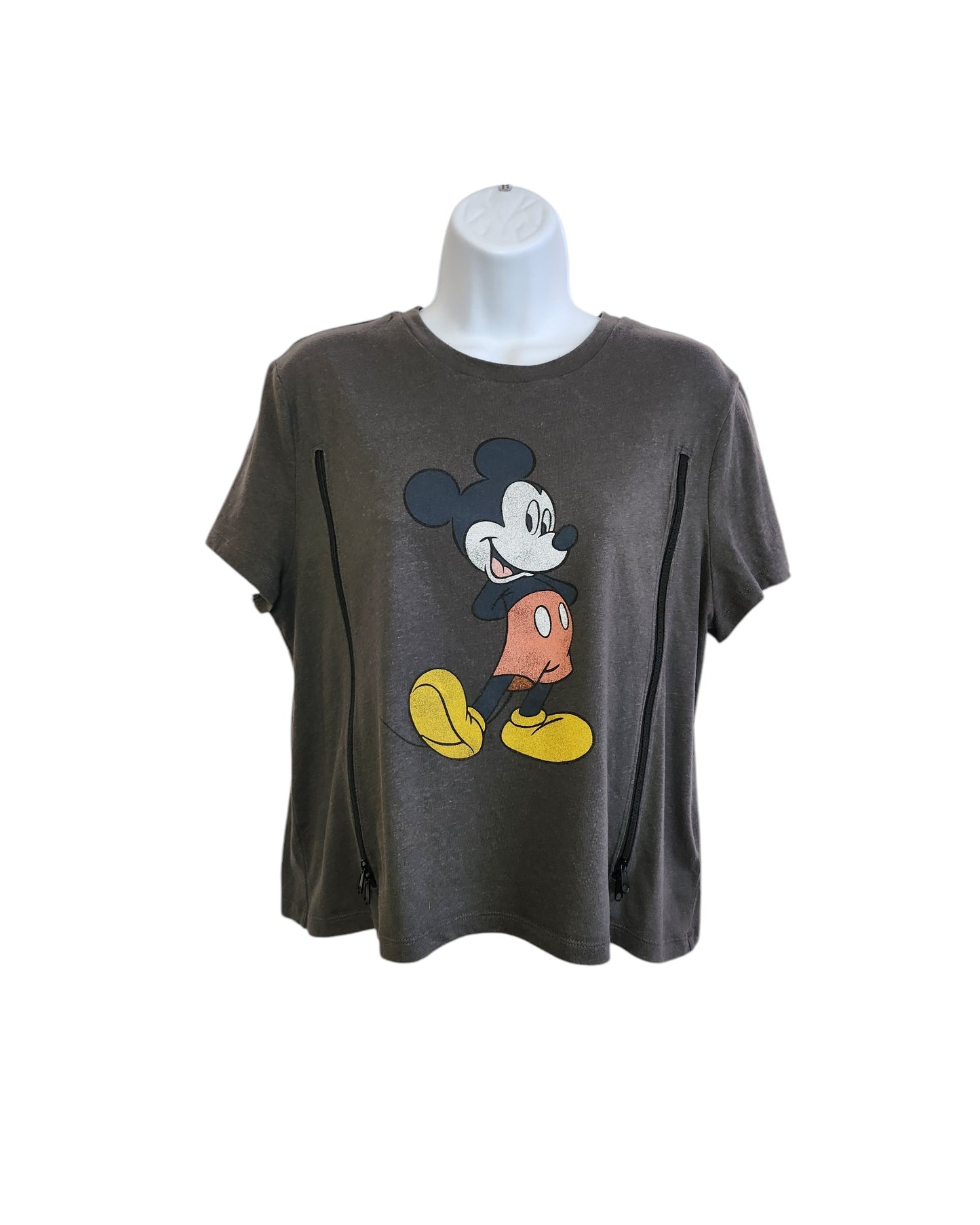 The Upcycled Breastfeeding & Pumping Mickey Mouse Cropped T-shirt by touched out mama, in gray on a white mannequin, showcases a vintage-style cartoon character with large ears, red shorts, and yellow shoes. Eco-friendly zippers run from shoulders to hem for unique flair.