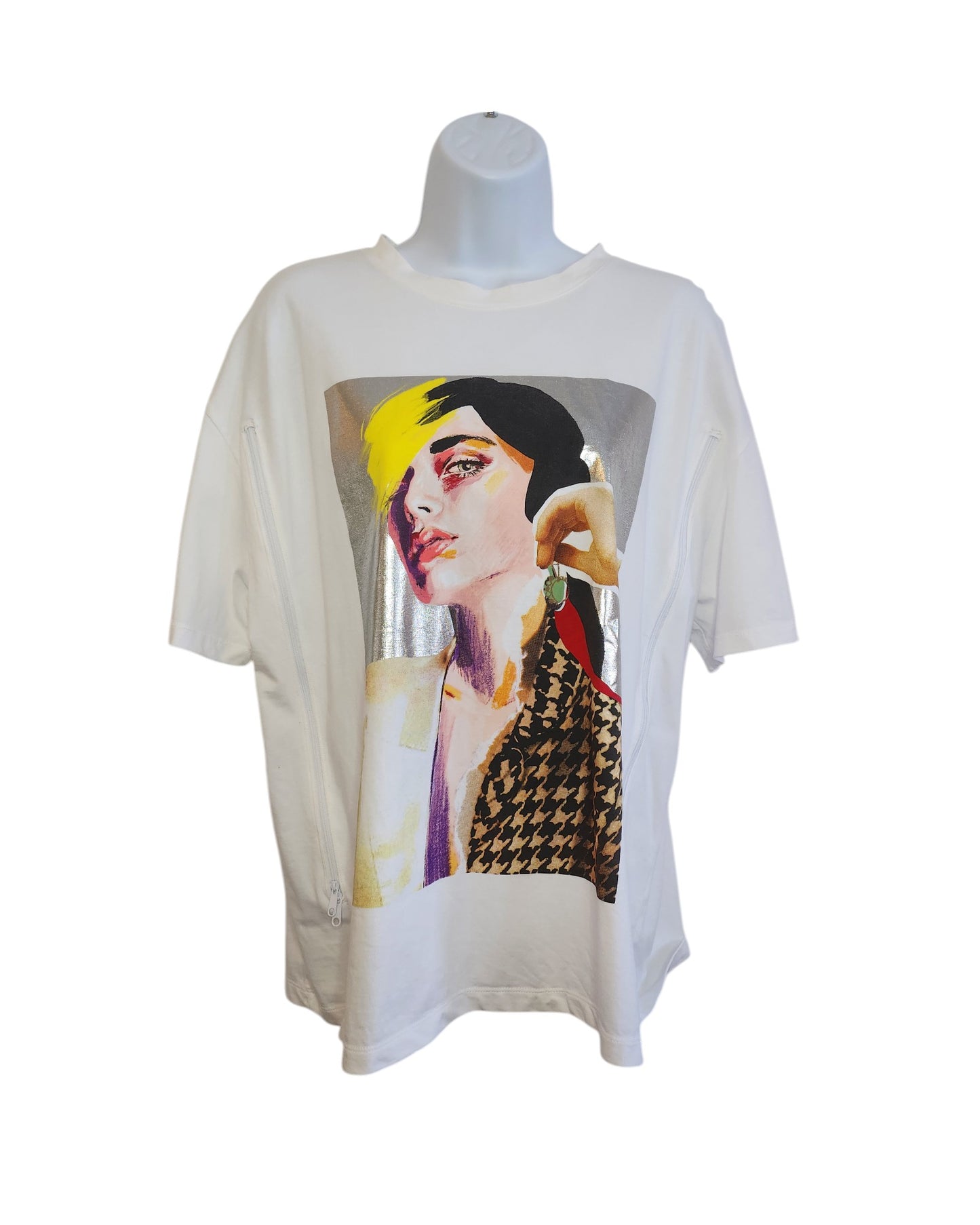 Displayed on a mannequin, the Upcycled Breastfeeding & Pumping Silver Face T-shirt by touched out mama features a vibrant graphic of an abstract womans portrait in yellow, red, and black. This eco-friendly white tee champions sustainability with style.
