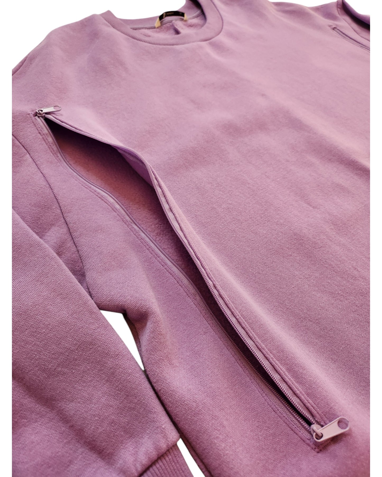 A close-up of the Tu Upcycled Breastfeeding & Pumping Purple Sweatshirt Dress UK14, featuring a side zipper from hem to underarm that reveals its soft interior—an eco-friendly choice for comfort and conscious style.