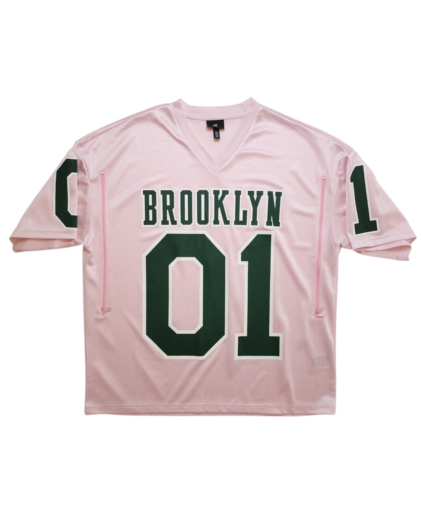 This H&M Upcycled Breastfeeding & Pumping Football Jersey XL is a light pink sports jersey made from preloved clothing, featuring bold green BROOKLYN lettering and number 01 on the chest and sleeves.