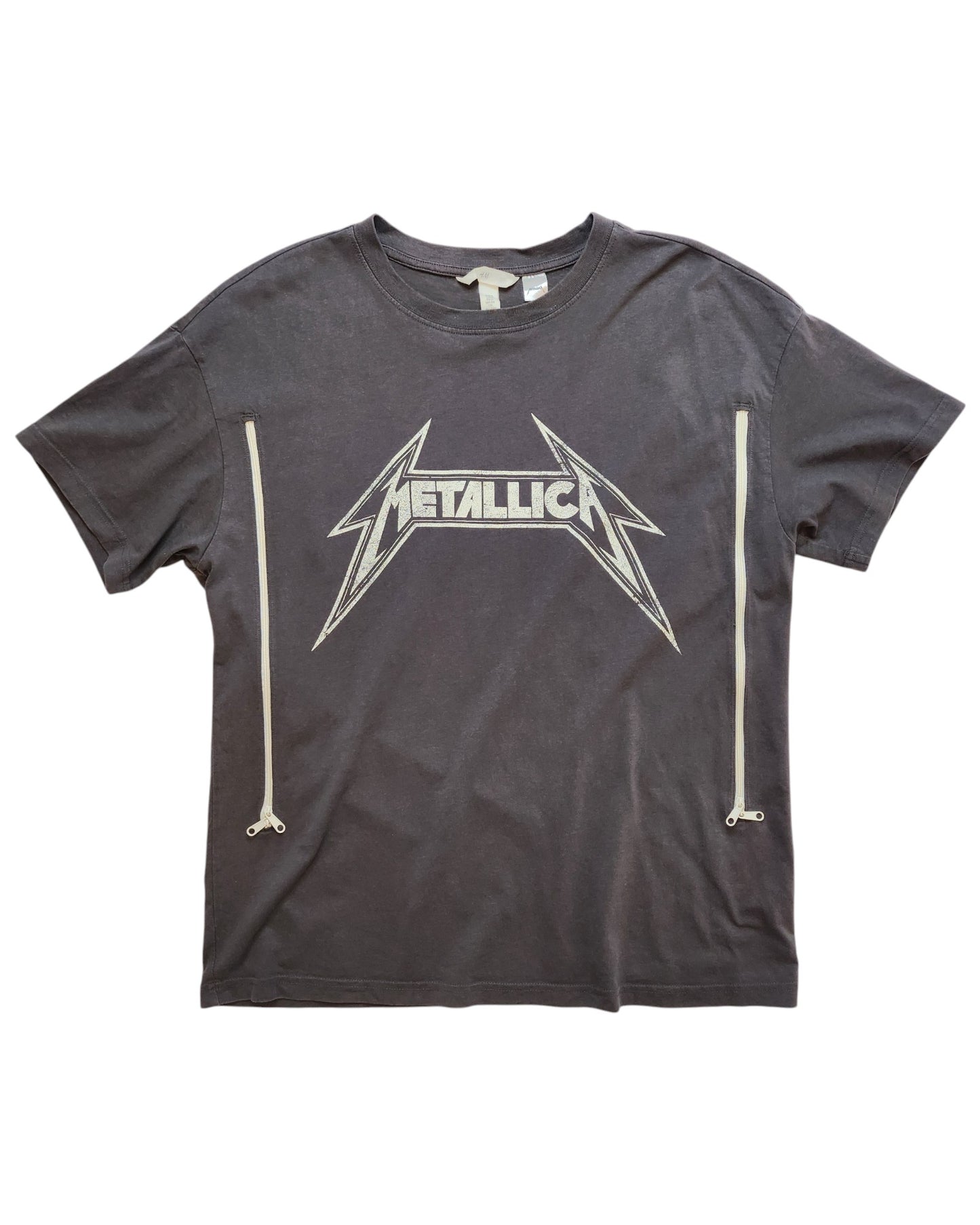 The Upcycled Breastfeeding & Pumping Metallica Grey T-shirt S by touched out mama features a white Metallica logo, is crafted from upcycled fabric, and includes vertical white zipper designs for a sustainable touch.