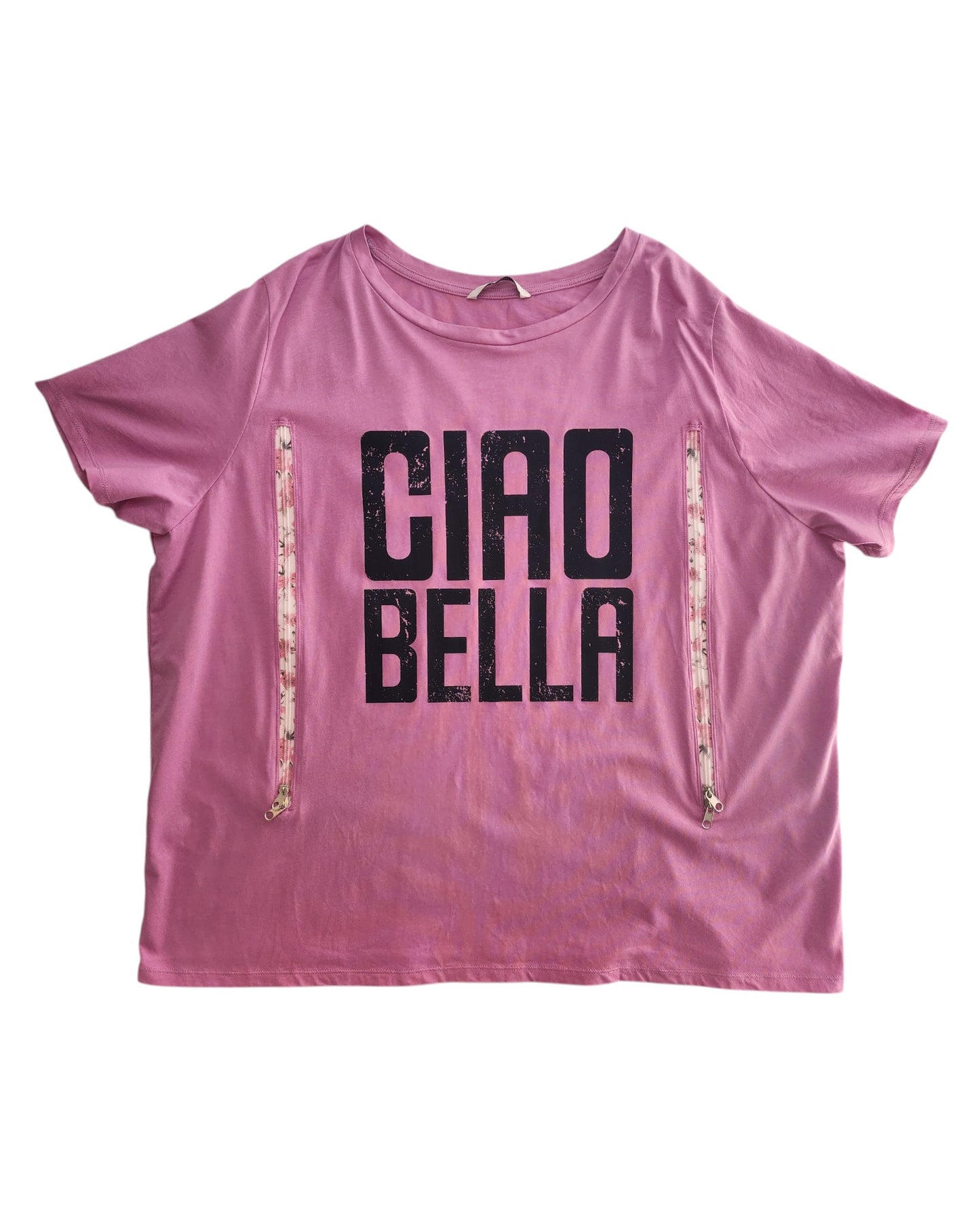 The Upcycled Breastfeeding & Pumping Ciao Bella t-shirt UK22 by touched out mama is crafted from repurposed clothing. It has CIAO BELLA in black on the front and features decorative side zippers, creating a unique eco-fashion statement.