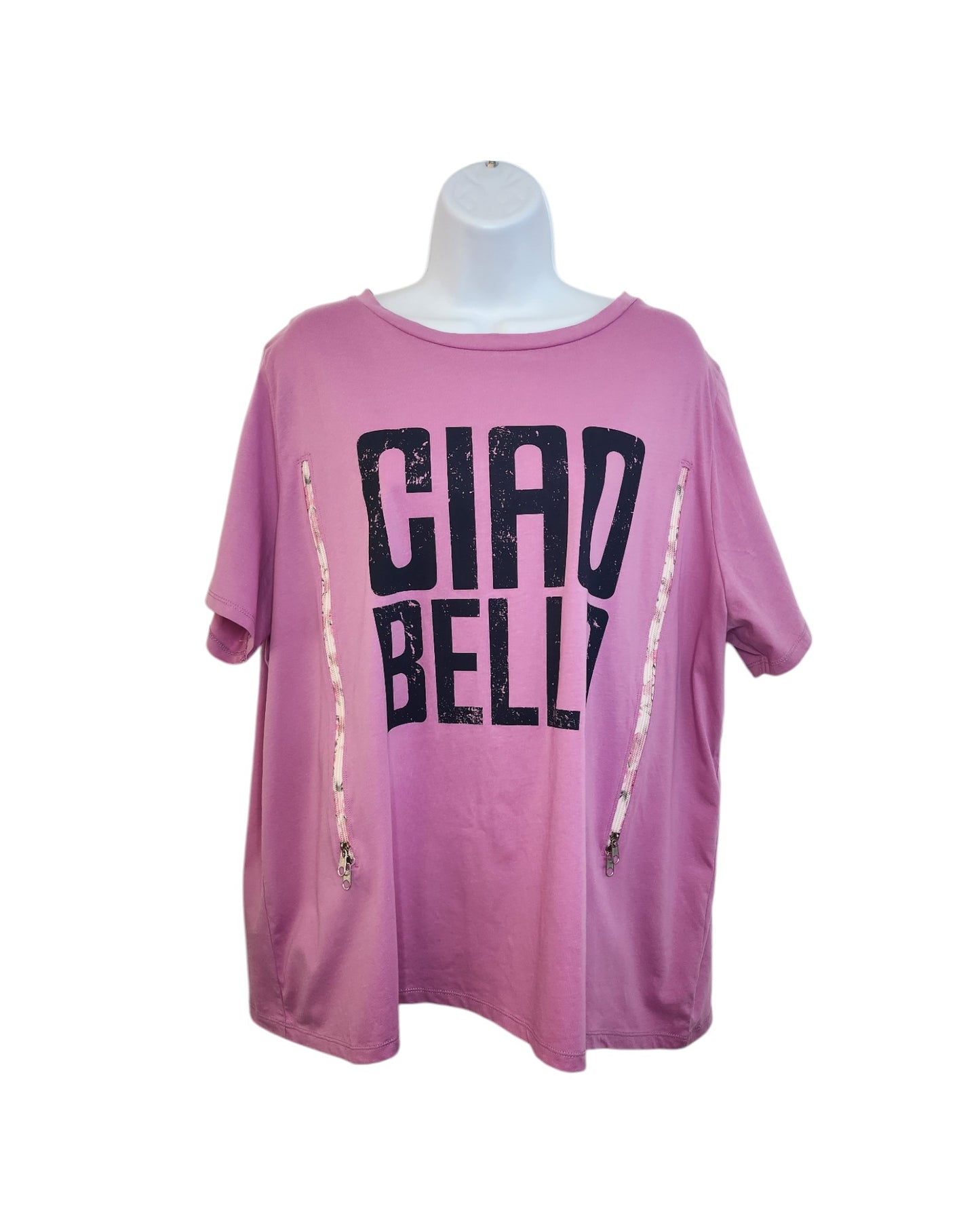 The mannequin displays a pink touched out mama Upcycled Breastfeeding & Pumping Ciao Bella t-shirt UK22 with CIAO BELLA in large black letters. This eco-friendly piece has short sleeves and decorative zippers on each side, combining style with sustainability.