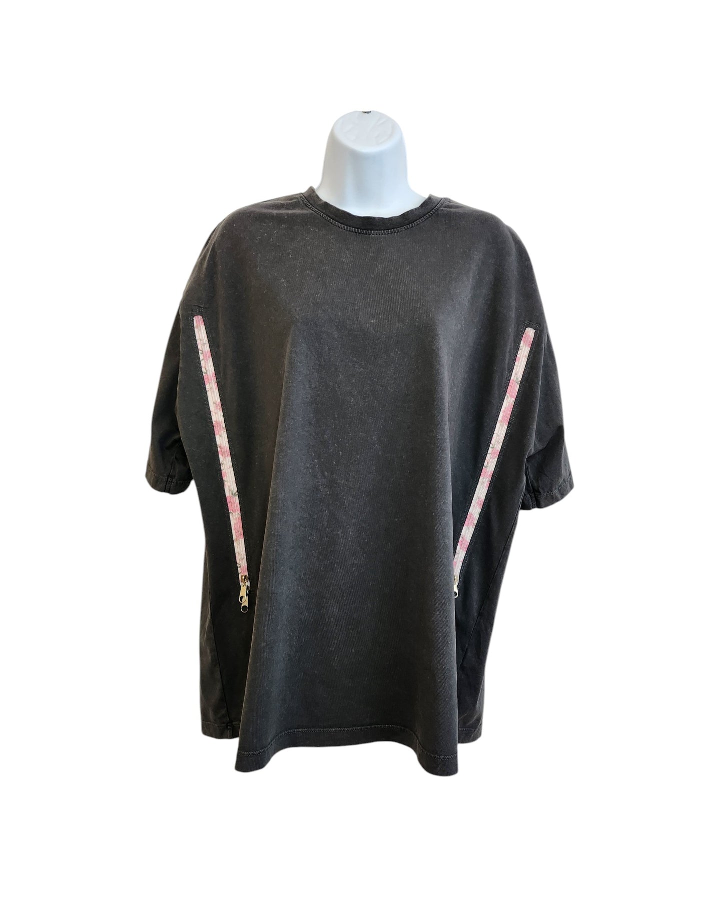 The Upcycled Breastfeeding Charcoal Floral Zip T-shirt UK14 by touched out mama is a stylish, eco-friendly black short-sleeve tee with two diagonal zippers featuring a red and white checkered pattern, perfect for breastfeeding. Its showcased on a white mannequin torso.