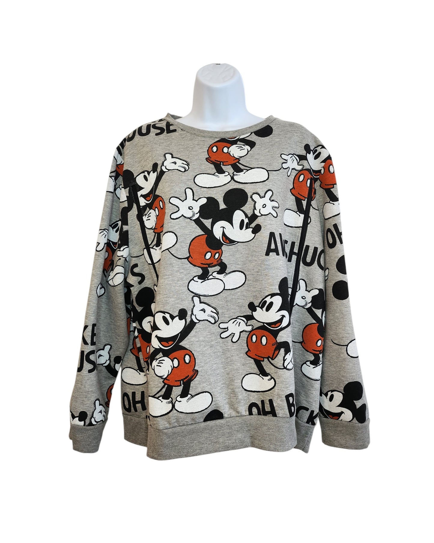 The Upcycled Breastfeeding Mickey Mouse Disney Sweatshirt by touched out mama in XL features playful vintage cartoon poses and lettering in red, white, and black. Its an eco-friendly fashion piece displayed on a headless mannequin.