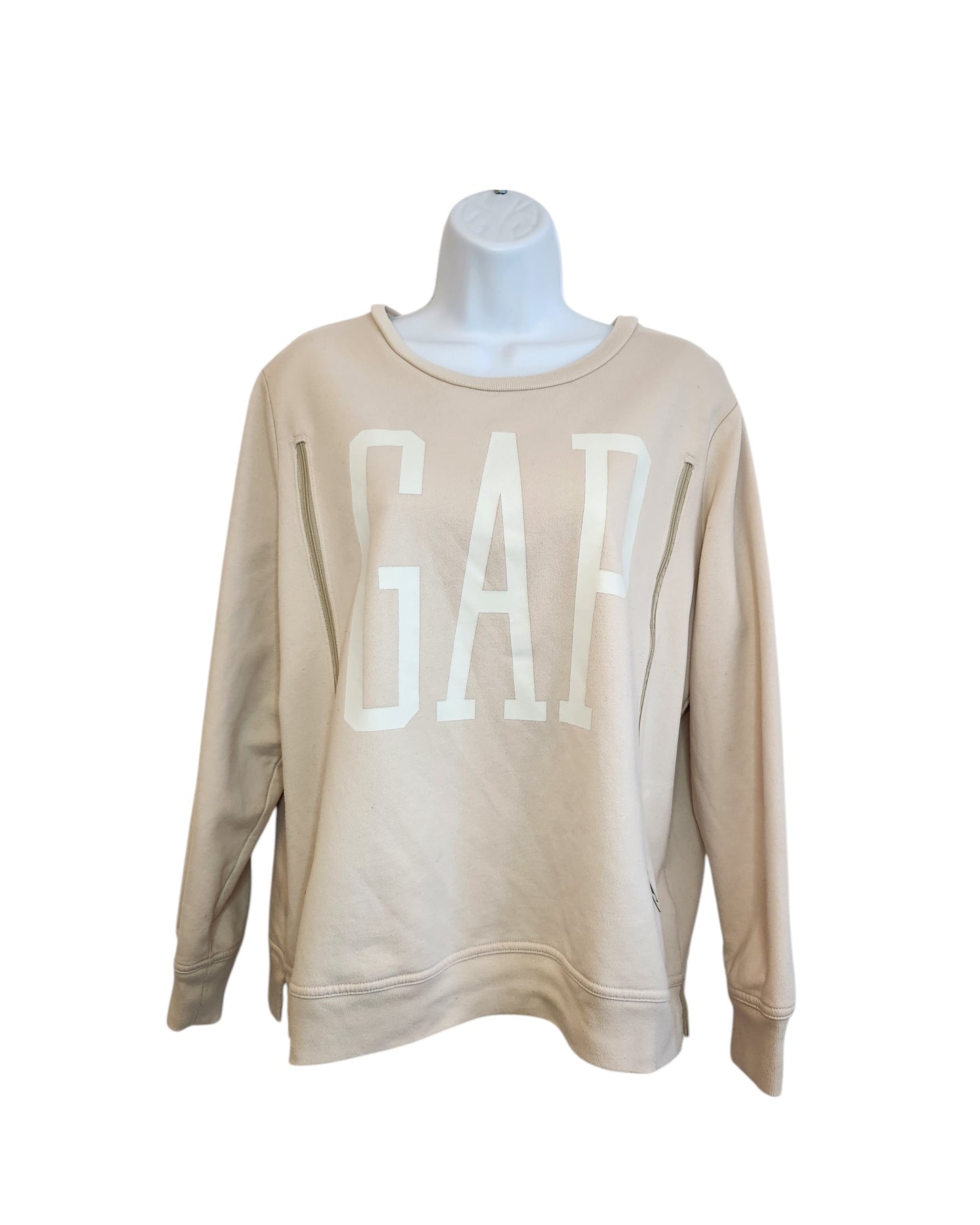 Displayed on a mannequin torso, this preloved touched out mama beige sweatshirt presents GAP in large white letters on the front, offering a sustainable fashion choice.