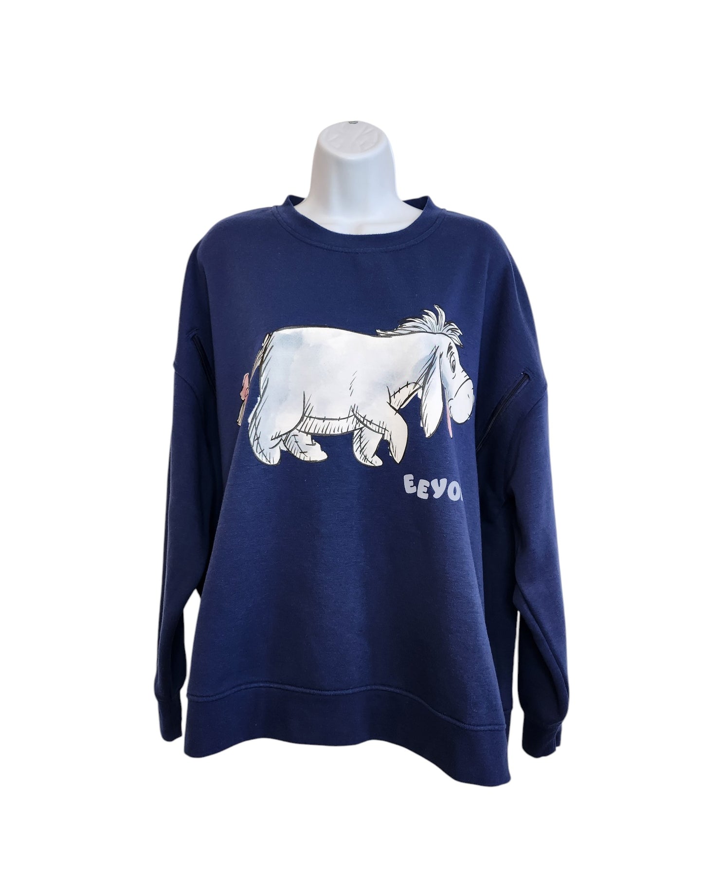 The Primark Upcycled Breastfeeding & Pumping Eeyore Disney Sweatshirt 2XL features a large Eeyore print and his name, blending eco-friendly style and fun, shown on a white mannequin torso.