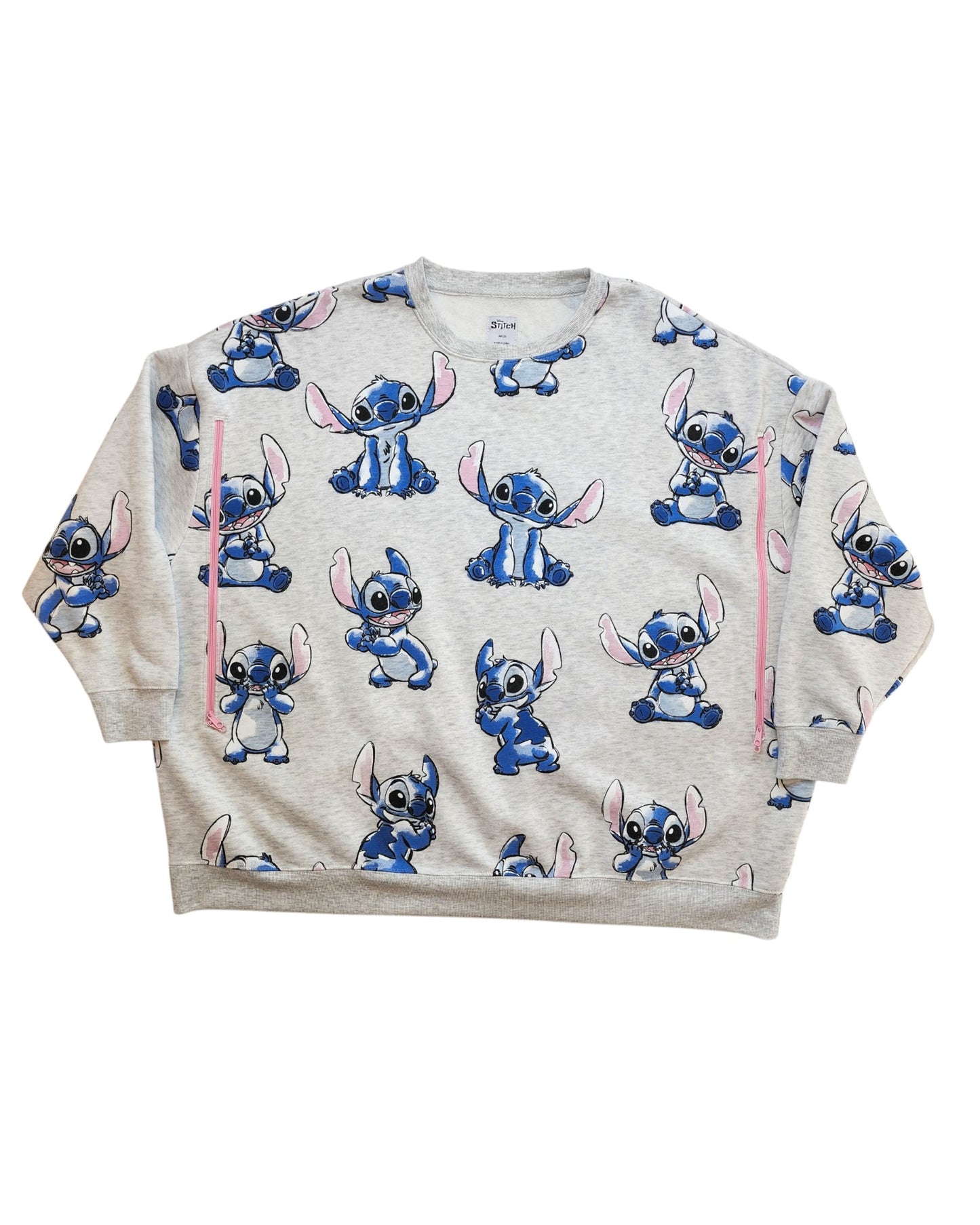 The Primark Upcycled Breastfeeding & Pumping Stitch Disney Sweatshirt 2XL features an all-over playful Stitch print, long sleeves, and a relaxed fit, made from preloved clothing for comfort.