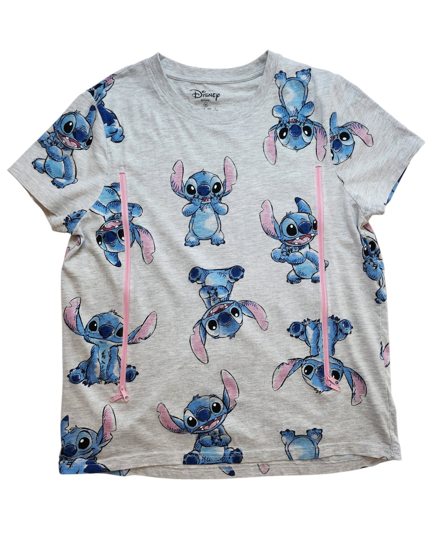 This preloved grey T-shirt from touched out mama features playful blue creatures with large ears, pink vertical stripes, and the Disney logo at the neckline, adding charm to this upcycled breastfeeding and pumping piece.
