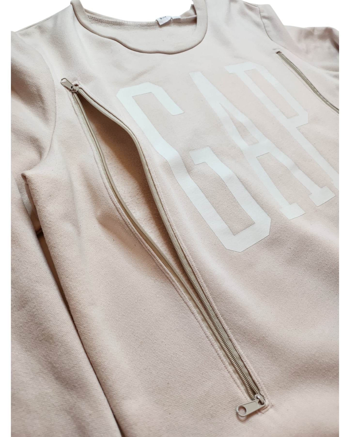 The touched out mama Upcycled Breastfeeding & Pumping Cream GAP Sweatshirt L features GAP in large white letters, ideal for breastfeeding moms with two vertical shoulder-to-hem zippers. Its sustainably crafted, merging practicality and style effortlessly.