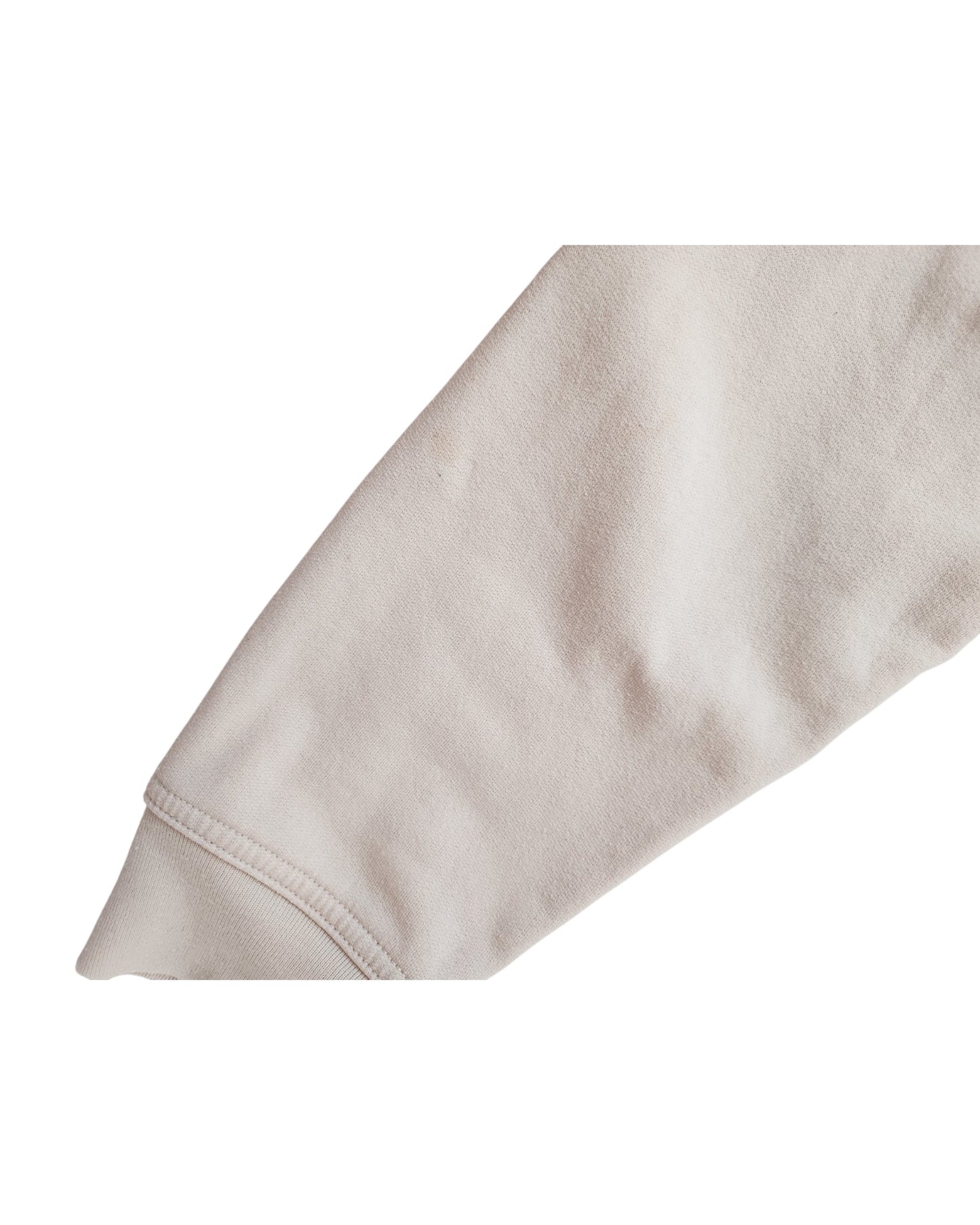 The preloved, long-sleeve Upcycled Breastfeeding Cream GAP Sweatshirt L by touched out mama features visible seam details at the cuff and subtle folds that emphasize the unique texture and flexibility of the beige fabric, captured against a white background.