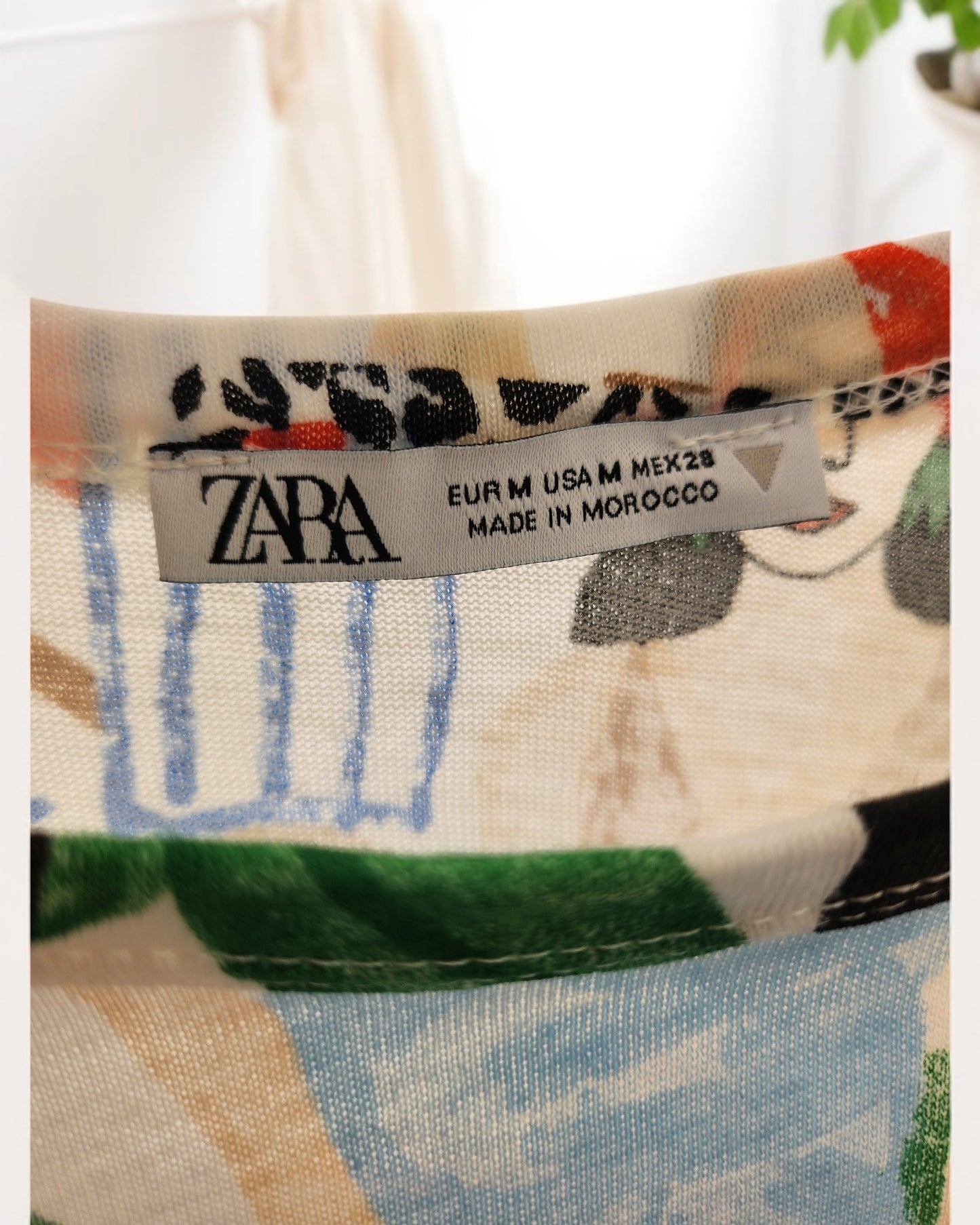 The Upcycled Breastfeeding & Pumping ZARA Tropical Maxi Dress M/L by touched out mama, labeled EUR M, USA M, and MEX 28, is crafted in Morocco with eco-friendly fabric in green, blue, black, and beige abstract patterns.