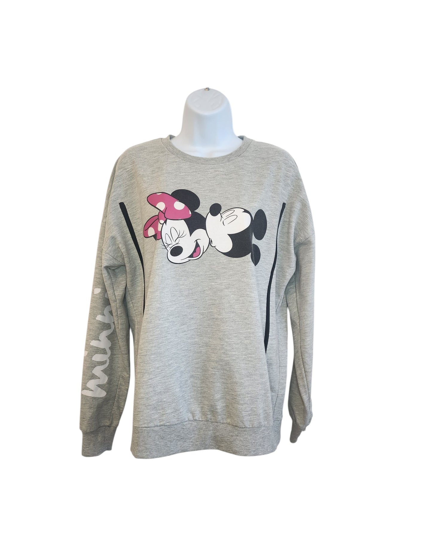 This upcycled, eco-friendly sweatshirt from touched out mama, adorned in gray with Minnie and Mickey Mouse graphic and black stripe accents, features Minnie printed on one sleeve. Its a preloved breastfeeding (nursing) & pumping piece displayed on a white mannequin torso. Size UK14.