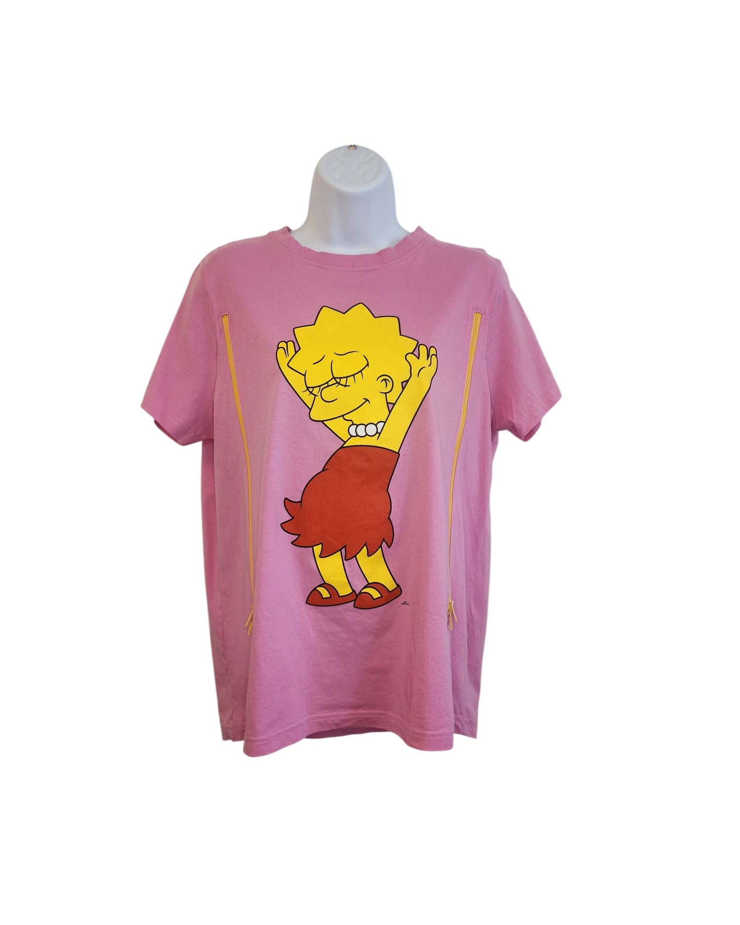 The preloved Upcycled Breastfeeding & Pumping Lisa Simpson T-shirt, sized M, by touched out mama is displayed on a mannequin. It features Lisa in a red dress joyfully raising her arms against a white backdrop, highlighting its charming appeal.