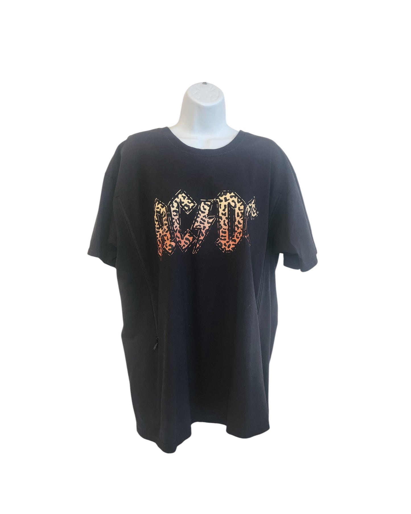 Displayed on the mannequin is a preloved fashion black T-shirt by touched out mama, featuring an upcycled XL AC DC design with striking leopard photo patterns.