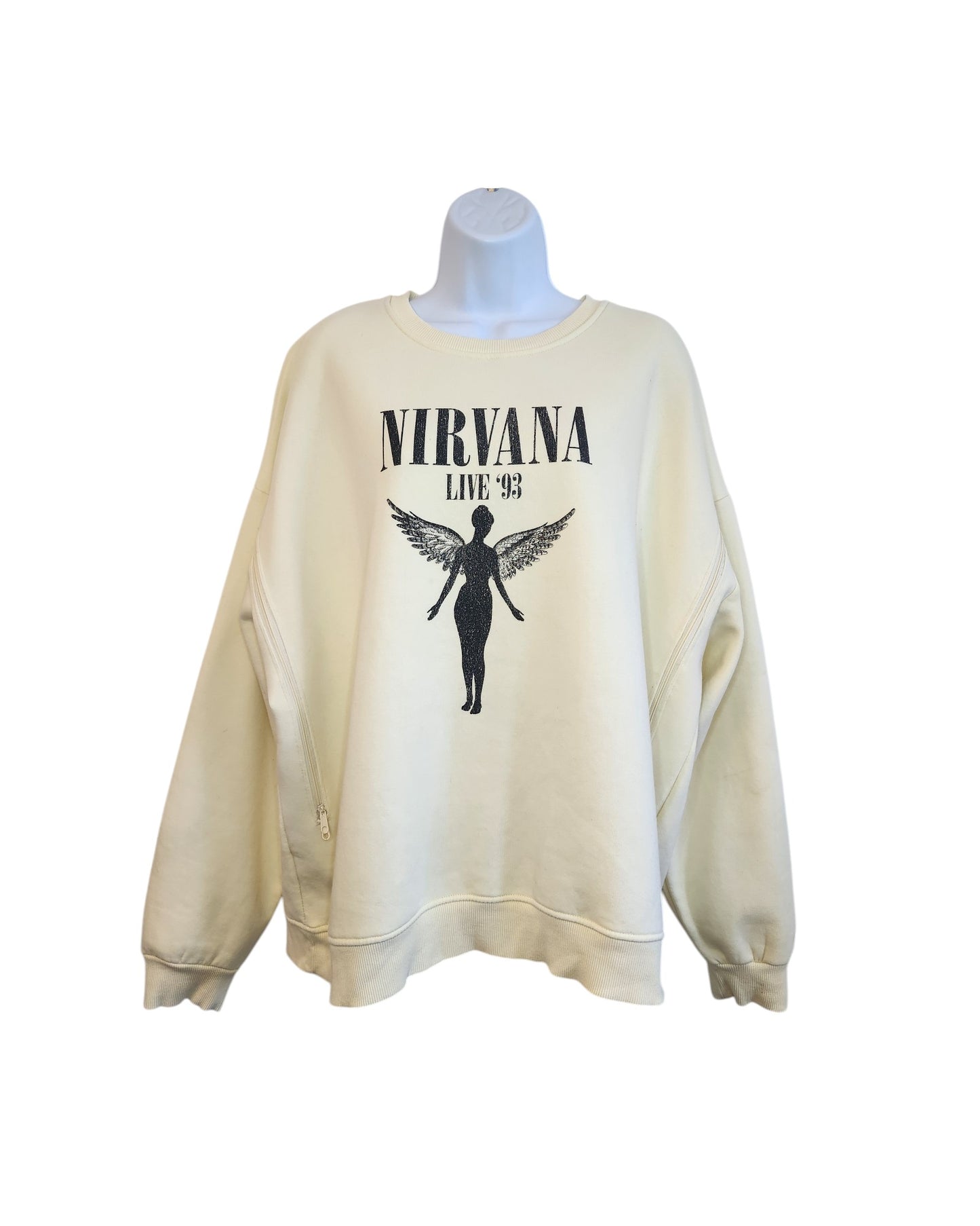 The Upcycled Breastfeeding & Pumping Cream Nirvana Sweatshirt L by touched out mama, showcases NIRVANA LIVE 93 and an angelic silhouette on a cream-colored fabric. This eco-friendly, affordable piece features a relaxed fit and is displayed on a mannequin against a white backdrop.