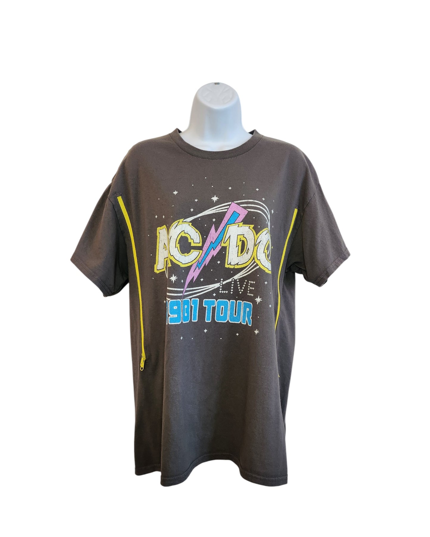 A mannequin displays an upcycled XL Upcycled Breastfeeding & Pumping Grey AC DC Tour t-shirt by touched out mama, featuring a vintage-style dark gray design with a yellow lightning bolt and vibrant text, breathing new life into preloved clothing.