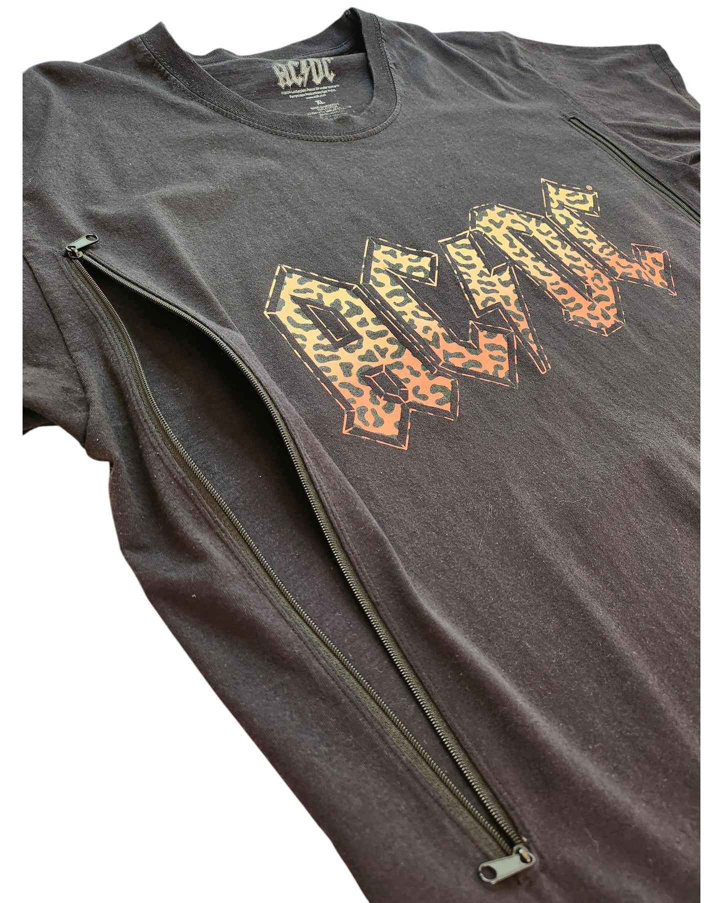 The Upcycled Breastfeeding (Nursing) & Pumping Leopard AC DC t-shirt XL by touched out mama is a trendy black tee with leopard print AC/DC letters and zippers from underarms to the bottom for stylish convenience.