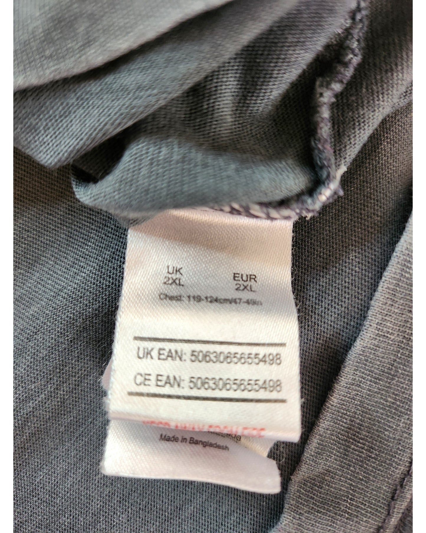 Close-up of a preloved Upcycled Breastfeeding & Pumping The Killers t-shirt by touched out mama in size UK/EUR 2XL, chest 119-126 cm or 47-49 inches. Made in Bangladesh, UK and CE EAN: 5063065655498. Fabric texture remains beautifully visible.
