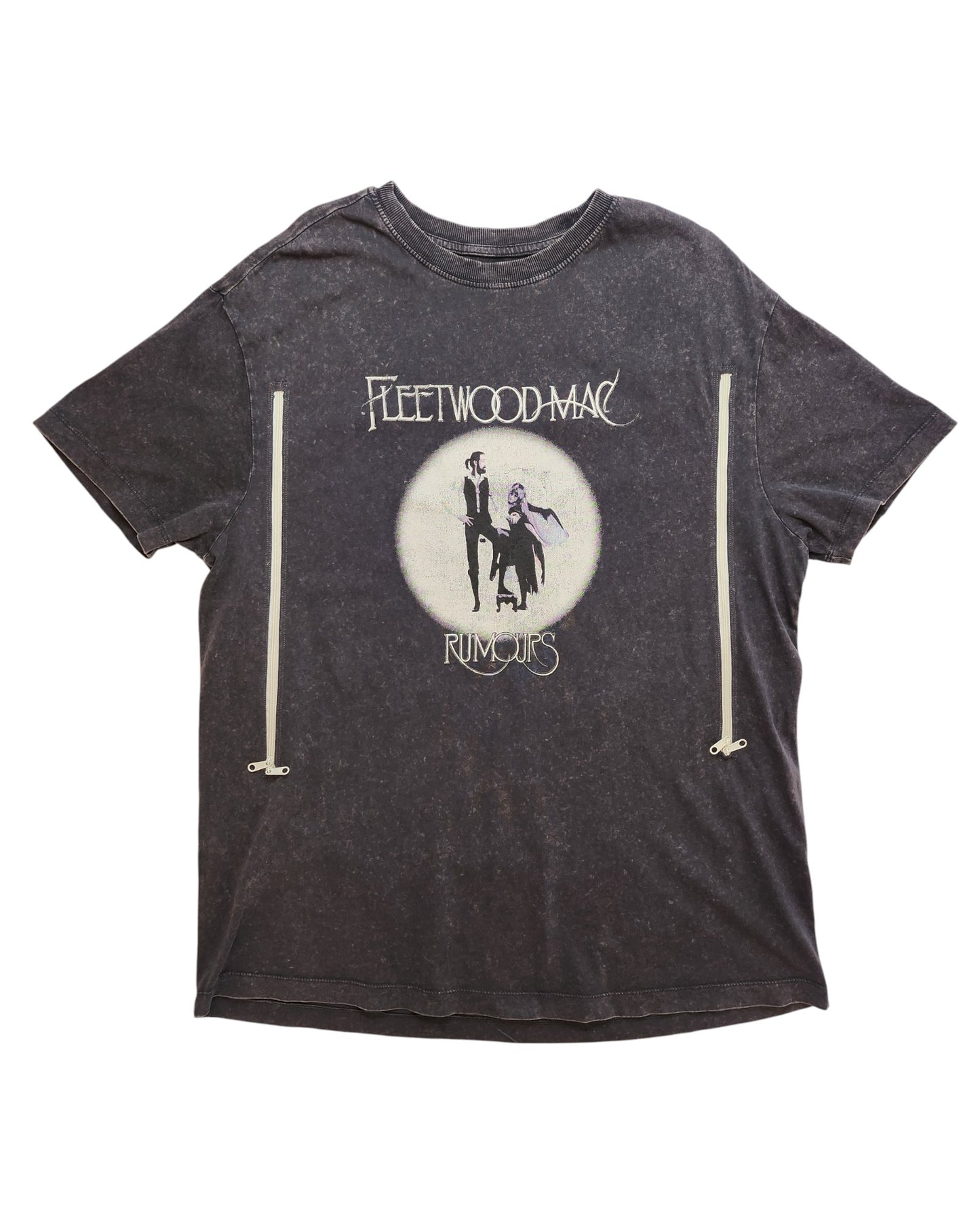 A faded black upcycled t-shirt by touched out mama in size UK16 features a Fleetwood Mac Rumours design with a silhouetted figure in flowing garments against a circular background, prominently displaying the brand name and album title.