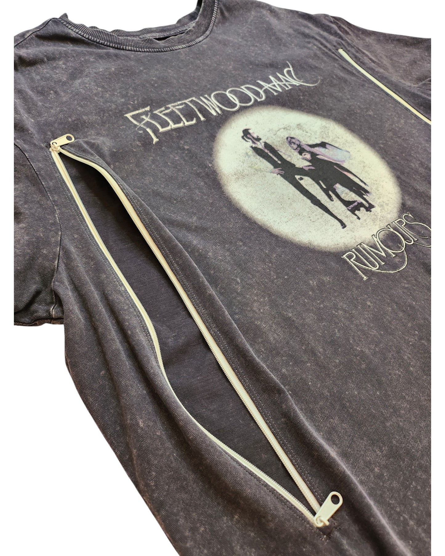 The Upcycled Breastfeeding & Pumping Fleetwood Mac Rumours T-shirt UK16 by touched out mama is a vintage black tee with yellow zippers from sleeves to hem, featuring a distressed look for an eco-friendly, upcycled charm.