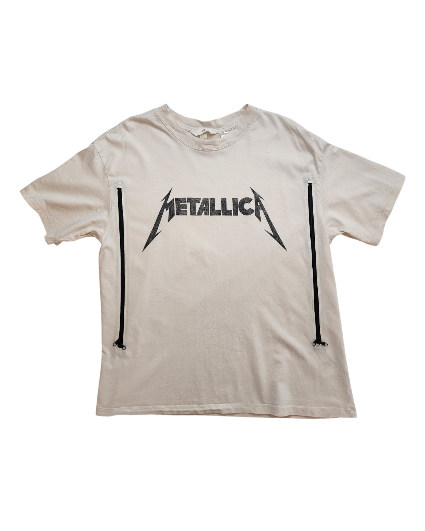 The Upcycled Breastfeeding & Pumping Cream Metallica T-shirt by touched out mama presents a black band logo with two vertical zippers, merging rock style with eco-friendly preloved fashion.