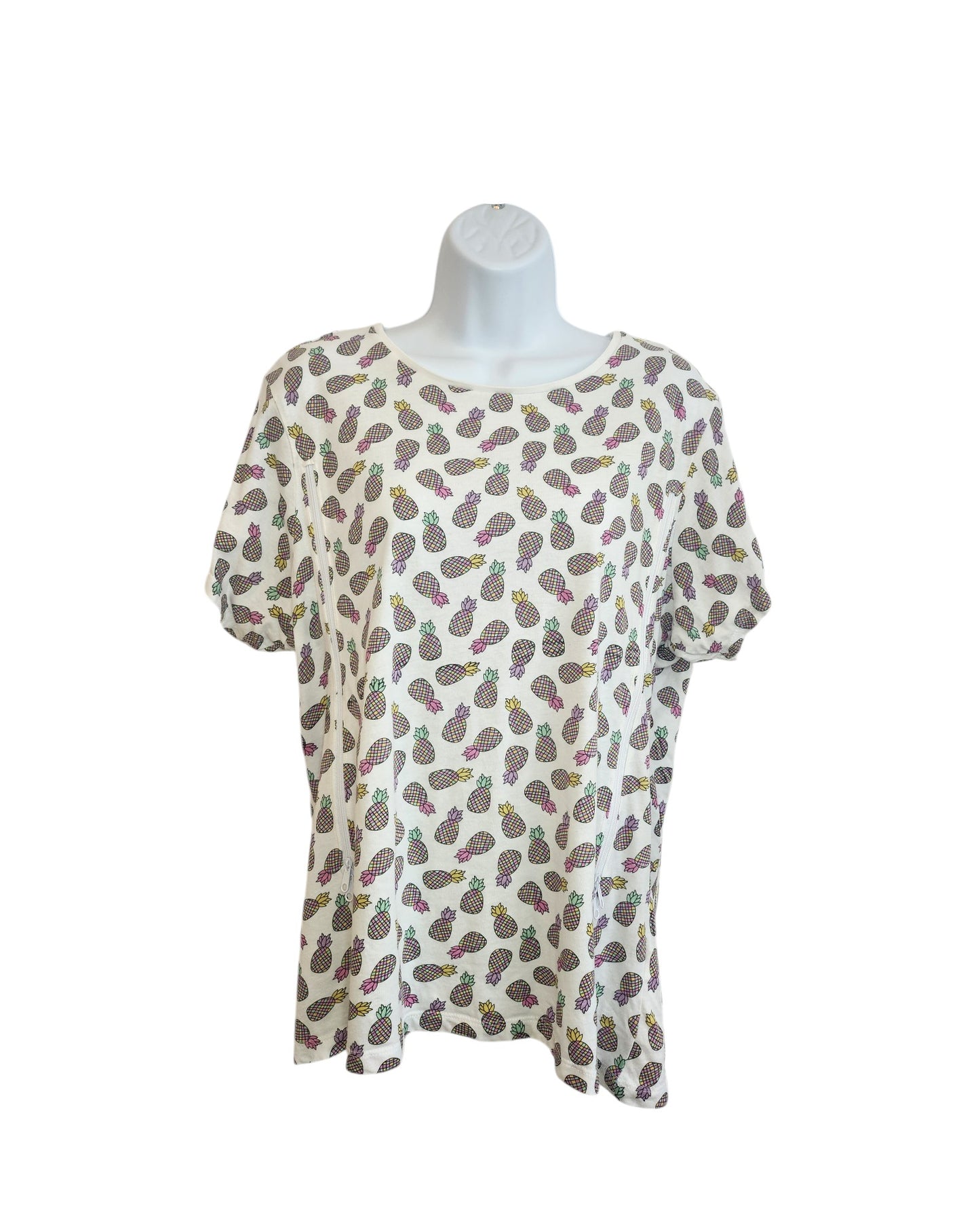 Primark Upcycled Breastfeeding & Pumping Pineapple t-shirt UK20, made from preloved clothing, features a colorful pineapple print on a white short-sleeve shirt. Shown on a simple white mannequin against a plain background.