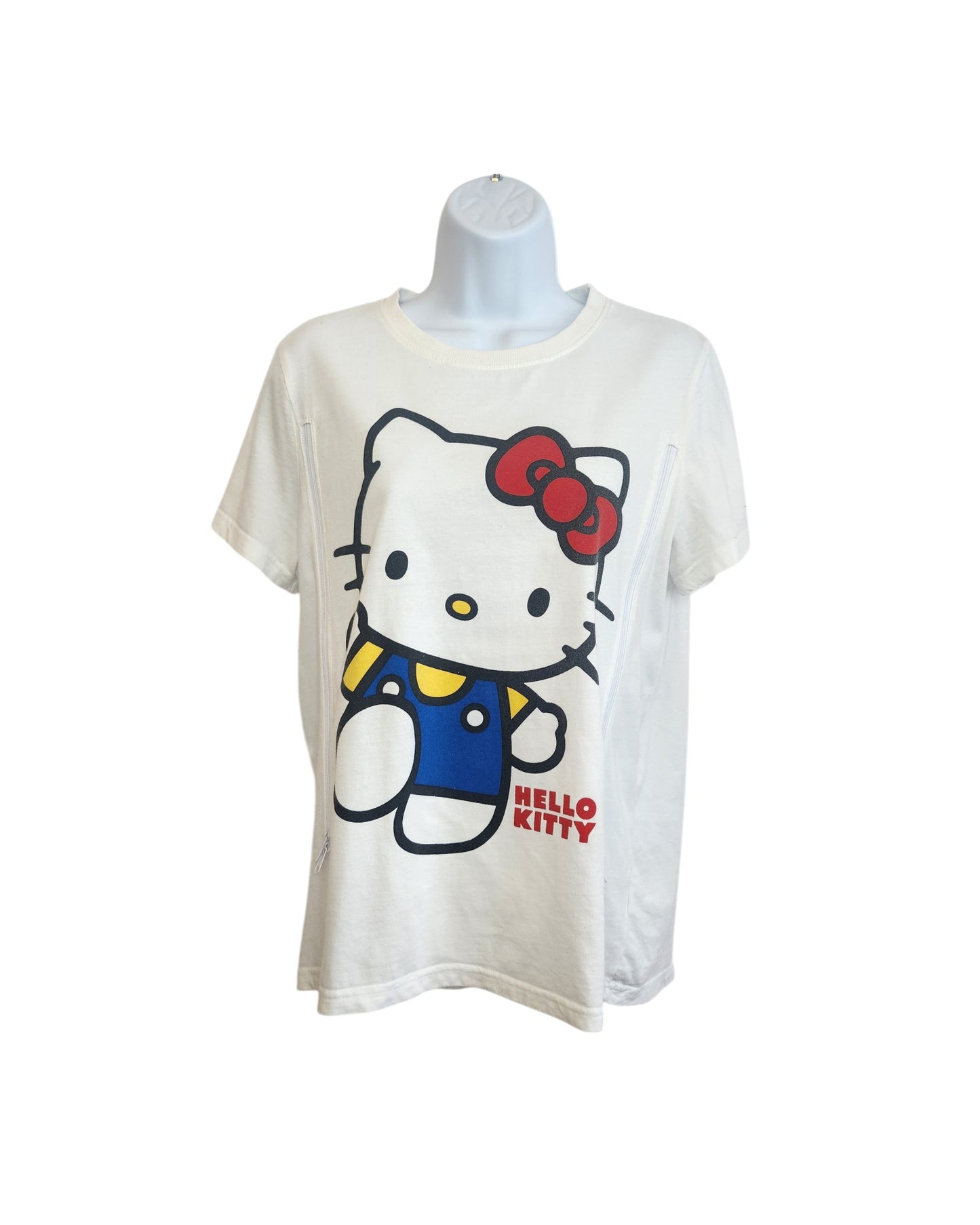 A white upcycled Primark Hello Kitty breastfeeding/pumping T-shirt (size S, UK10/12) features a large graphic of Hello Kitty in a blue outfit with red bow and HELLO KITTY text in red. Preloved item shown on mannequin.