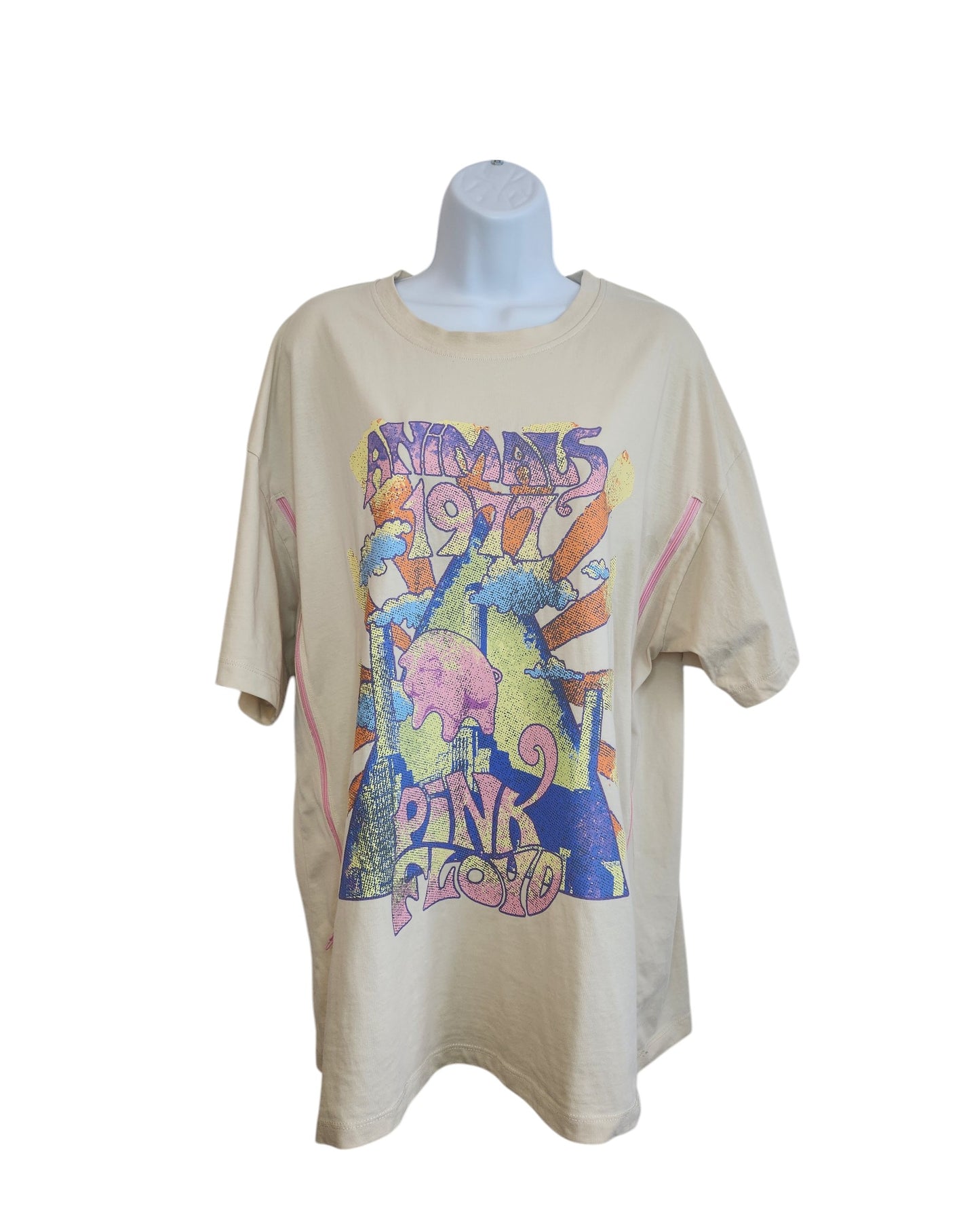 Primark’s Upcycled Nursing & Pumping Cream Pink Floyd t-shirt (M) is displayed on a mannequin, showcasing a colorful psychedelic Animals 1977 graphic with abstract shapes and vibrant sunbursts—made from premium upcycled clothing.