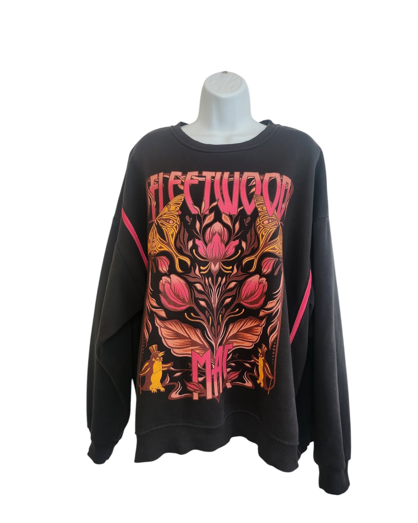 The Primark Upcycled Breastfeeding & Pumping Dark Grey Fleetwood Mac Floral Sweatshirt (L, UK14/16) features pink and orange floral and butterfly designs with bold Fleetwood Mac text. Eco-friendly, shown on a mannequin against a white background.