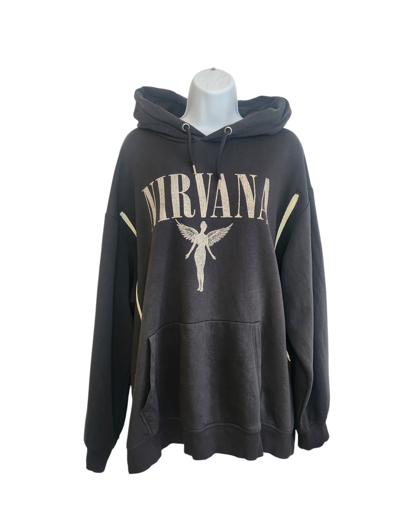 A grey XL Nirvana hoodie by H&M, upcycled for breastfeeding and pumping, features bold beige NIRVANA lettering and an angel graphic on the front. Displayed on a mannequin against a white background.