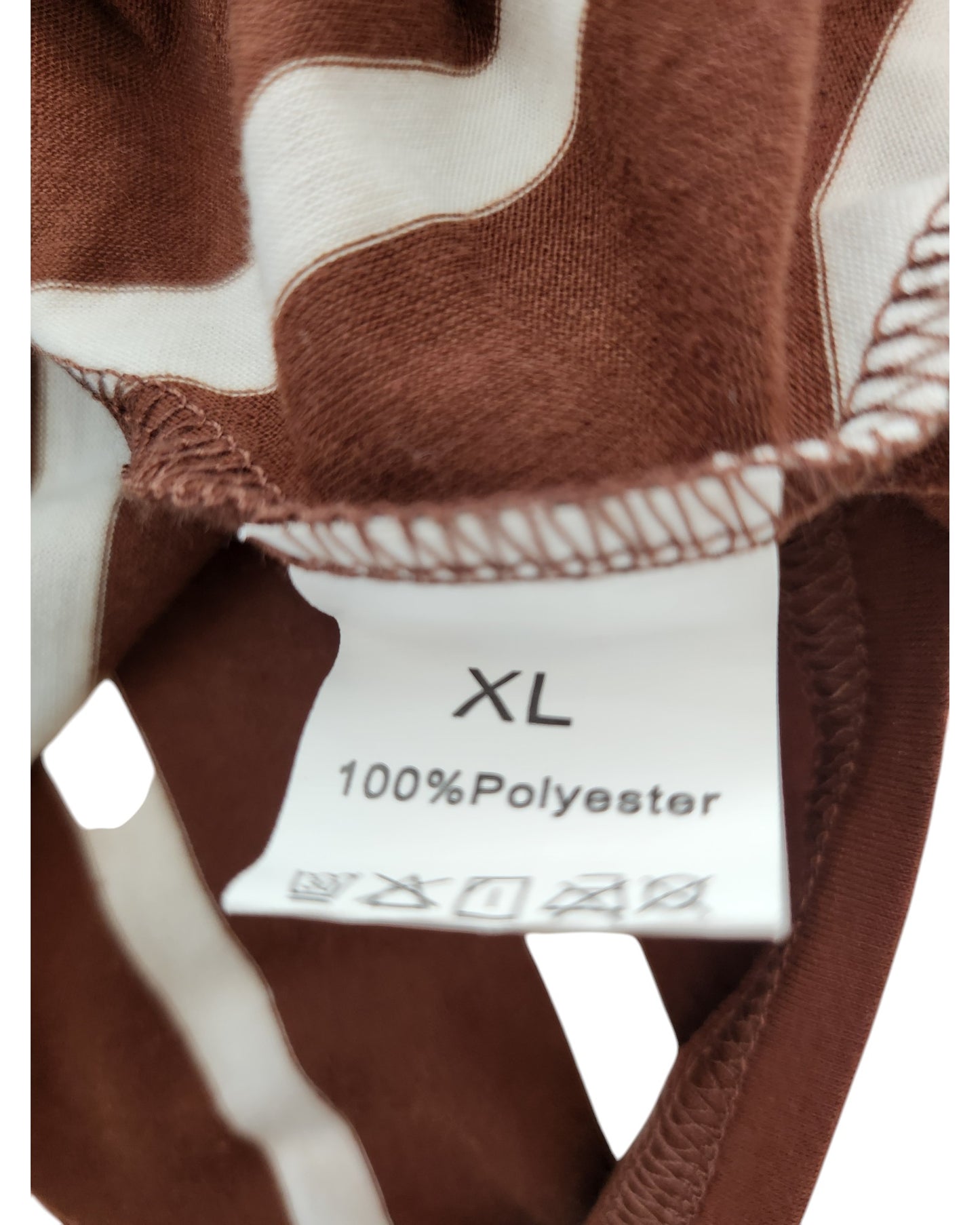 A close-up of the TikTok Upcycled Breastfeeding & Pumping Brown/Cream Stripe t-shirt dress tag, showing size XL and 100% Polyester in black text.