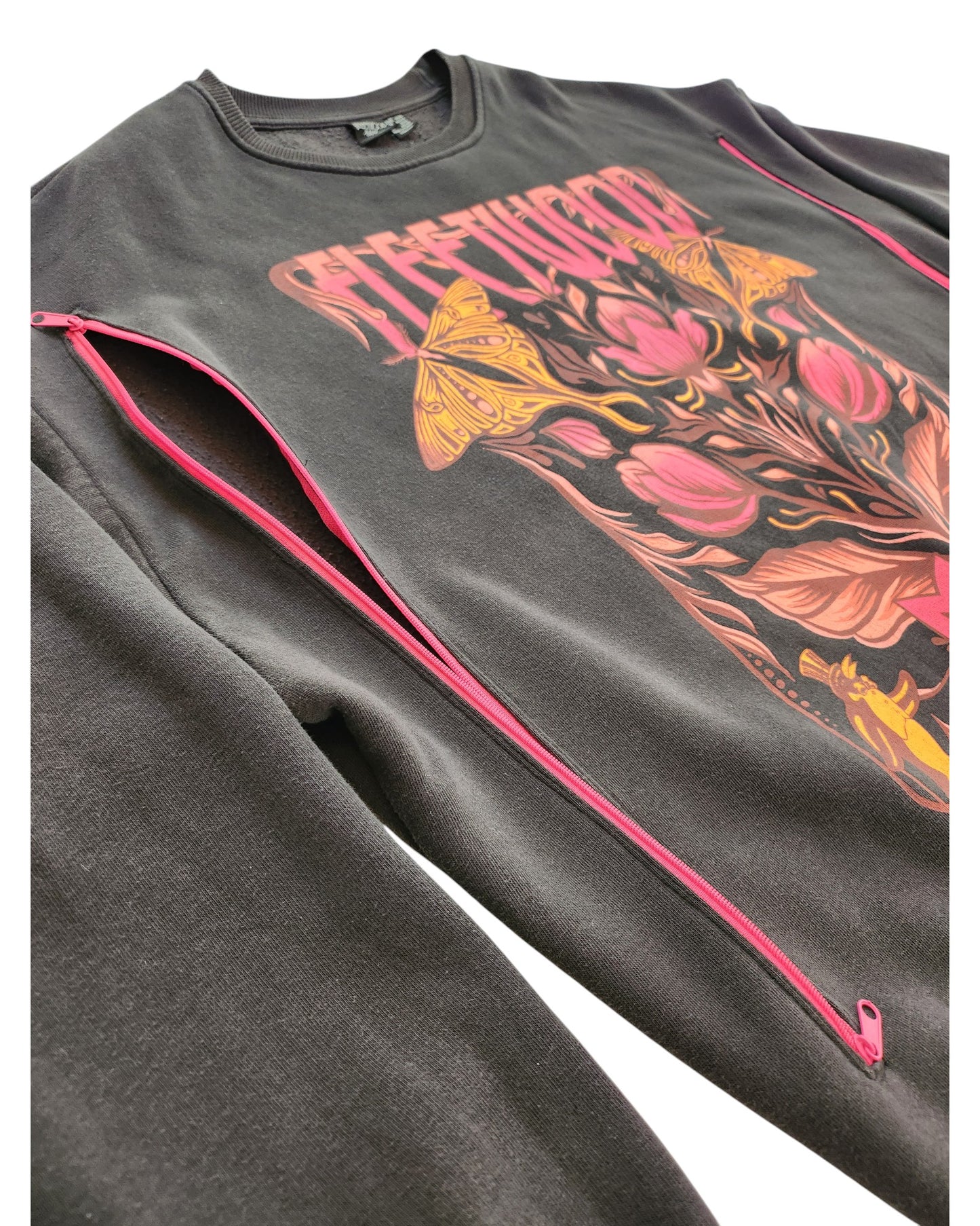 The Primark Upcycled Breastfeeding & Pumping Dark Grey Fleetwood Mac Floral Sweatshirt (L, UK14/16) features bold pink and yellow floral designs with moths, eco-friendly materials, and pink zippered sleeves from collar to wrist for added style.