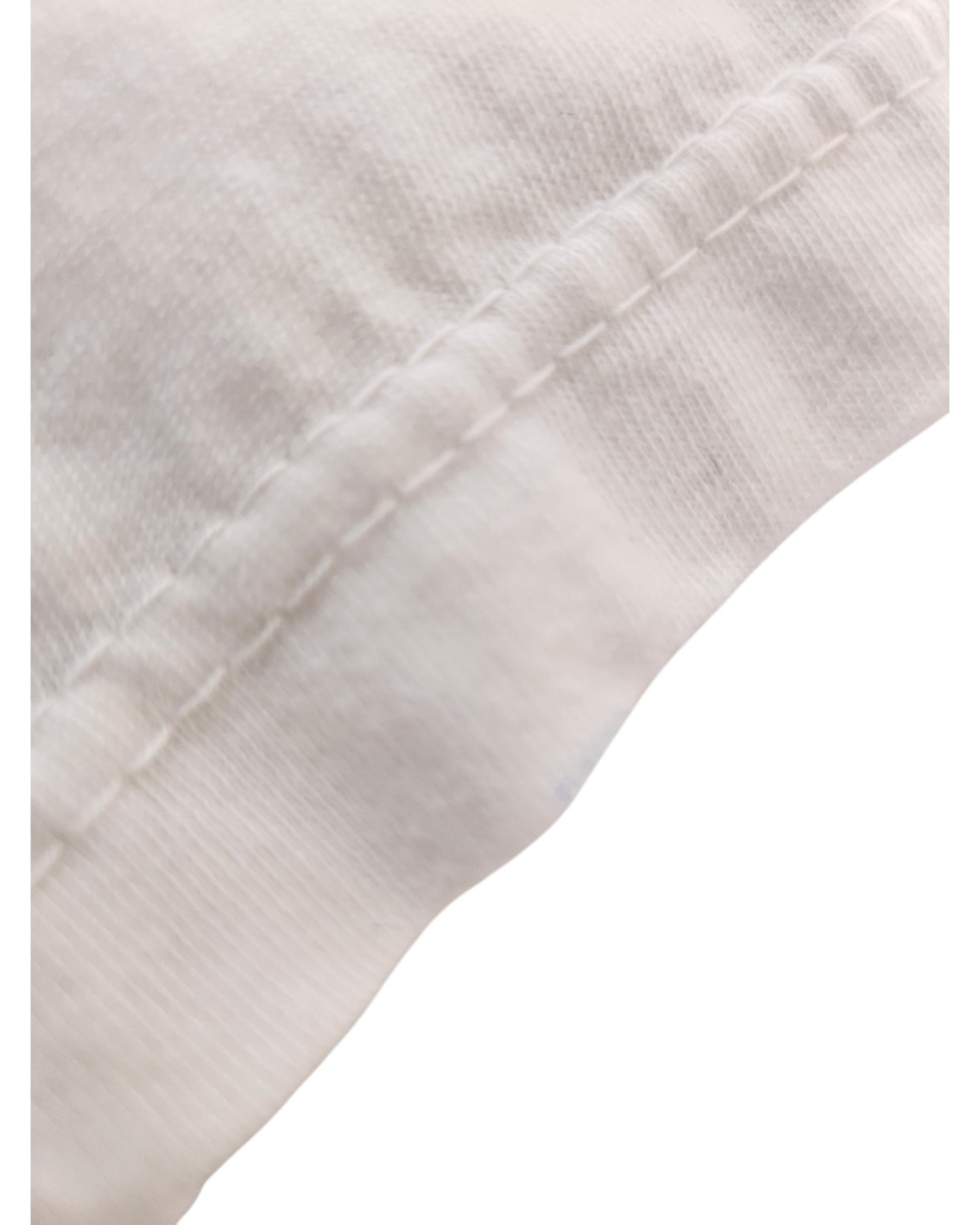 Close-up of a white Upcycled Breastfeeding & Pumping Times Square t-shirt by Sun Wear, size L, shows visible stitching and a diagonal seam, highlighting quality craftsmanship typical of upcycled apparel.
