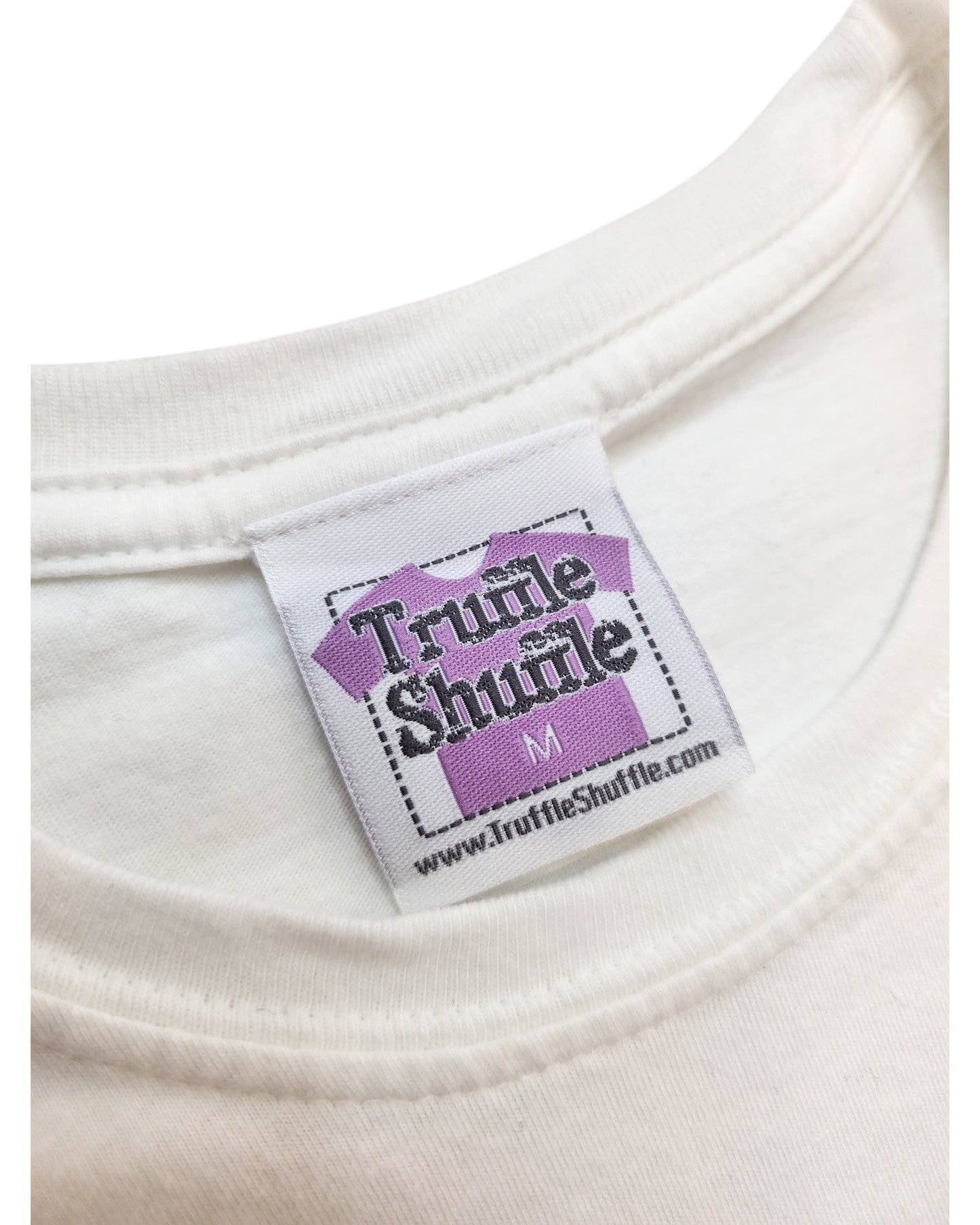 Close-up of a white collar with a Truffle Shuffle label on an upcycled Little Miss Sunshine breastfeeding & pumping T-shirt, size M—perfect for fans of preloved fashion. Shop at www.TruffleShuffle.com.