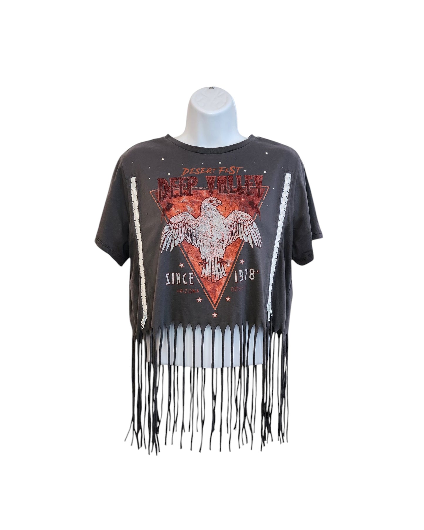 A grey upcycled Primark t-shirt (M, UK12/14) for breastfeeding and pumping, featuring festival-style white beaded fringe at the hem. Shown on a mannequin against a white background.