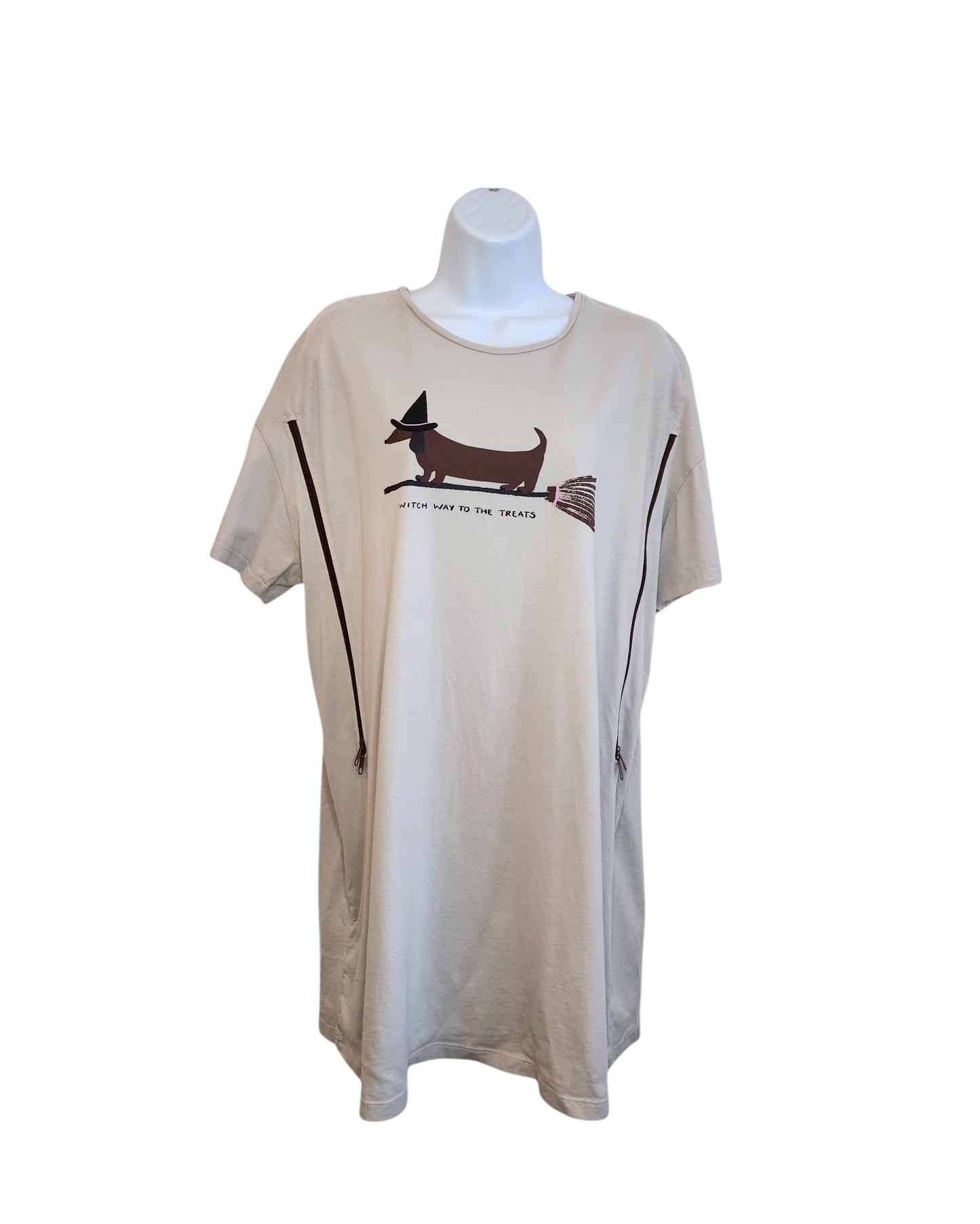 Tu’s Upcycled Breastfeeding & Pumping Witch Dog T-shirt Nightdress (L) in beige features a dachshund in a witch hat riding a broomstick with “Witch way to the treats?” text—crafted from eco-friendly upcycled clothing.