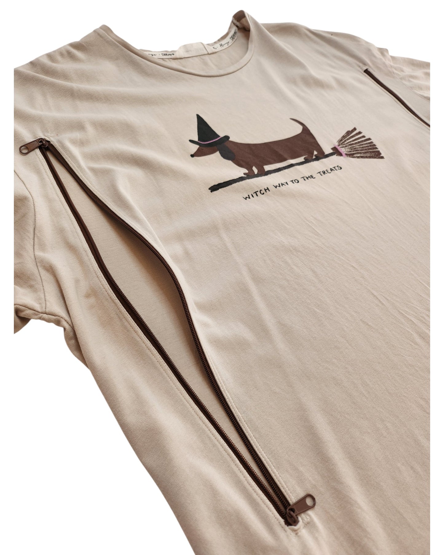 The Tu Upcycled Breastfeeding & Pumping Witch Dog T-shirt Nightdress (L) features a dachshund in a witch hat riding a broomstick with WITCH WAY TO THE TREATS text, plus two diagonal zippers from each armpit for easy nursing access.