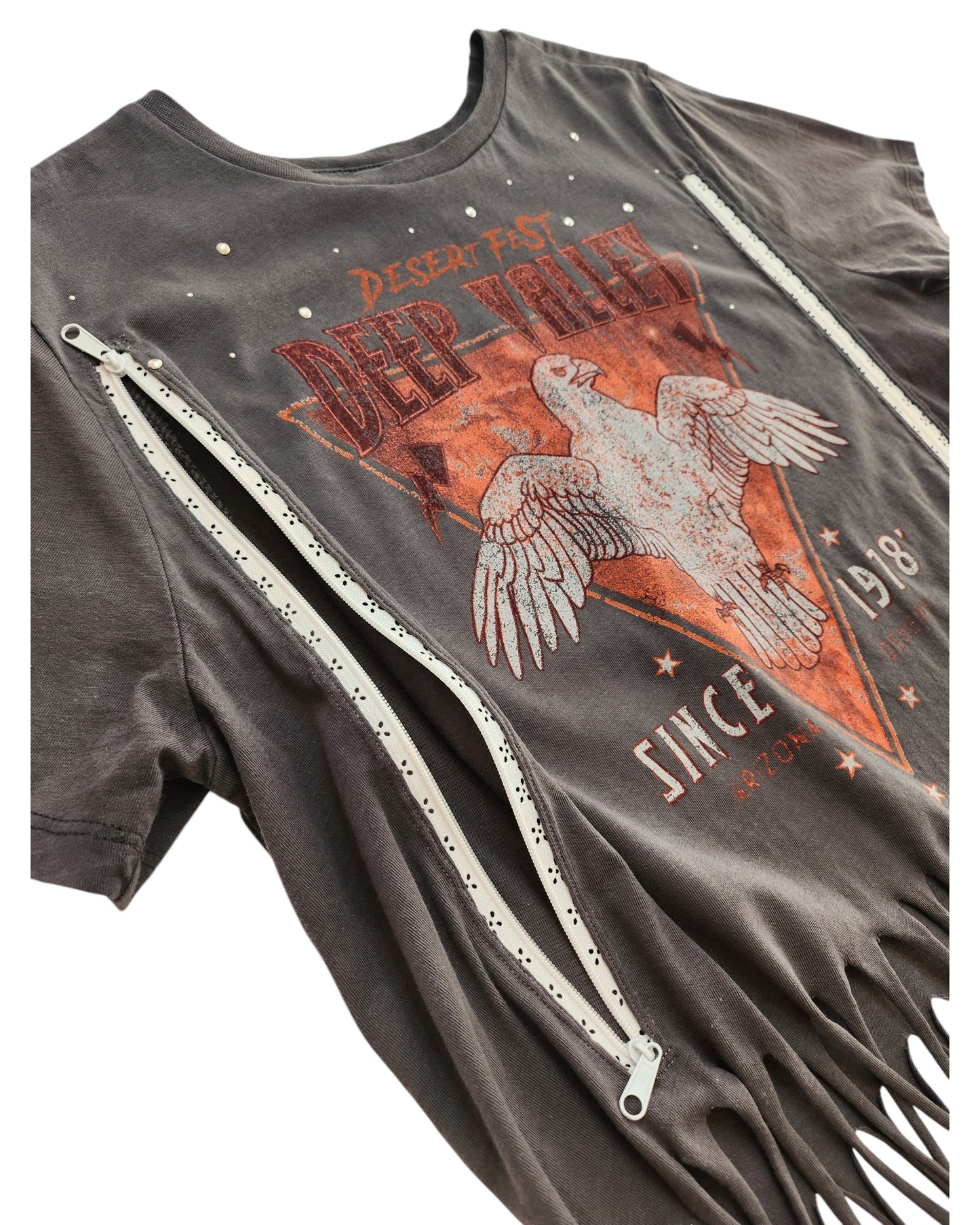 The Primark Upcycled Breastfeeding & Pumping Grey Festival Fringe t-shirt (M/UK12-14) features fringe detail, metal studs by the collar, white side zippers, and an eagle “Desert Fest Deep Valley Since 1978” graphic.