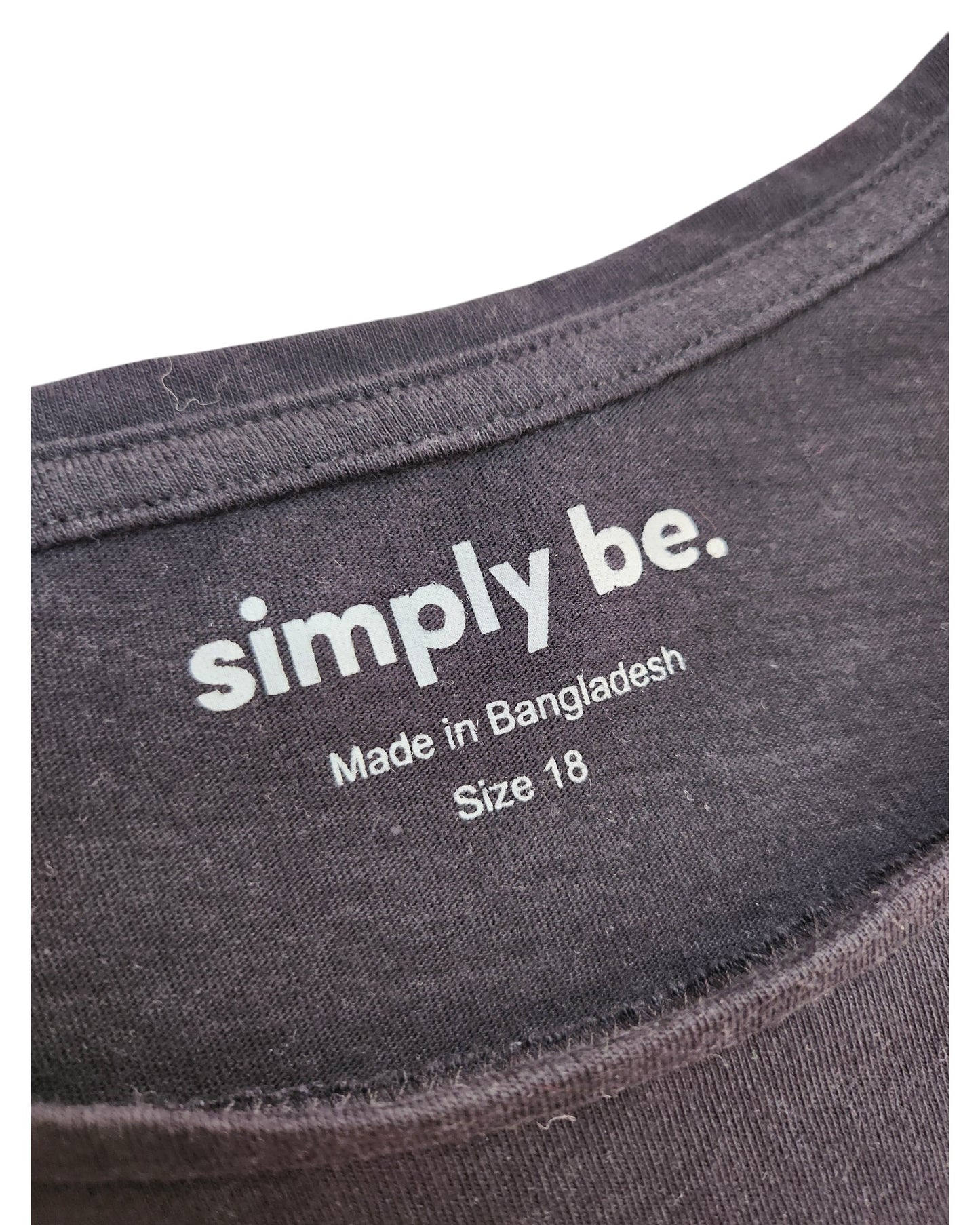 Close-up of a black Simply Be neck label reading simply be. Made in Bangladesh, Size UK18—an upcycled breastfeeding/pumping Black Love t-shirt, ideal for fans of preloved fashion.