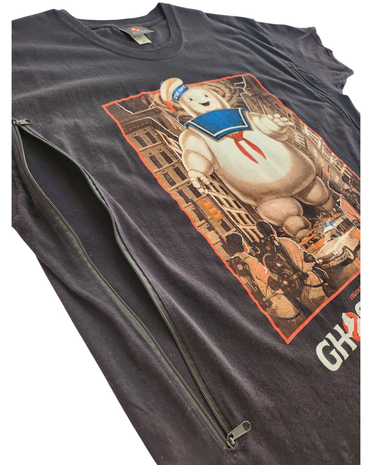 The Ghostbusters Upcycled Breastfeeding & Pumping T-shirt (XXL) features easy nursing access with a vertical side zipper, and showcases the Stay Puft Marshmallow Man design.