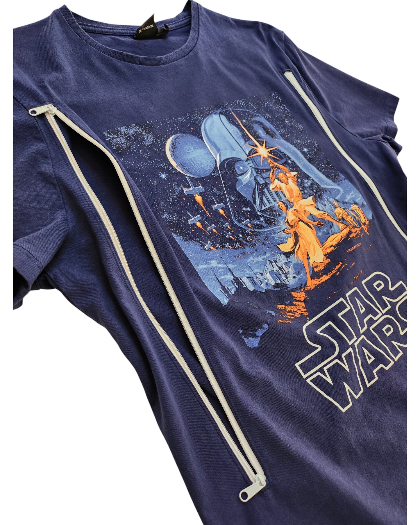The Primark Upcycled Breastfeeding Navy Blue Star Wars t-shirt (M) features a classic movie poster print and two diagonal white zippers on the front, offering a stylish and convenient option for nursing or pumping.